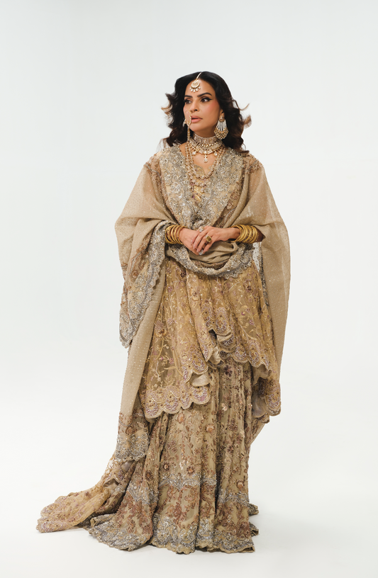 Fouzia Aman wearing farshi gharara, peplum, and dupatta.