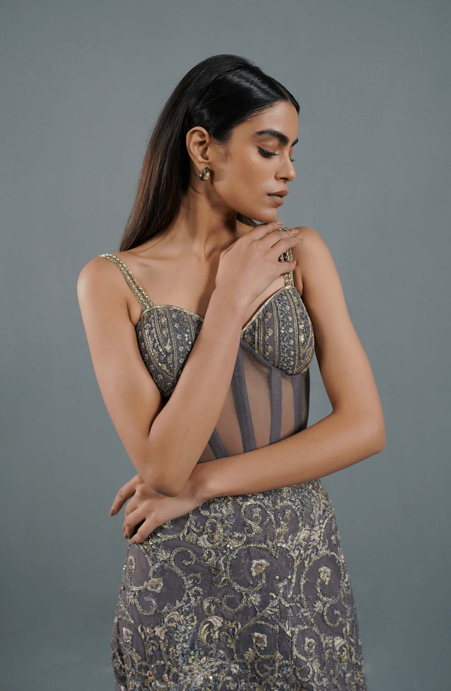 Side profile of elegant ash mauve skirt and corset set