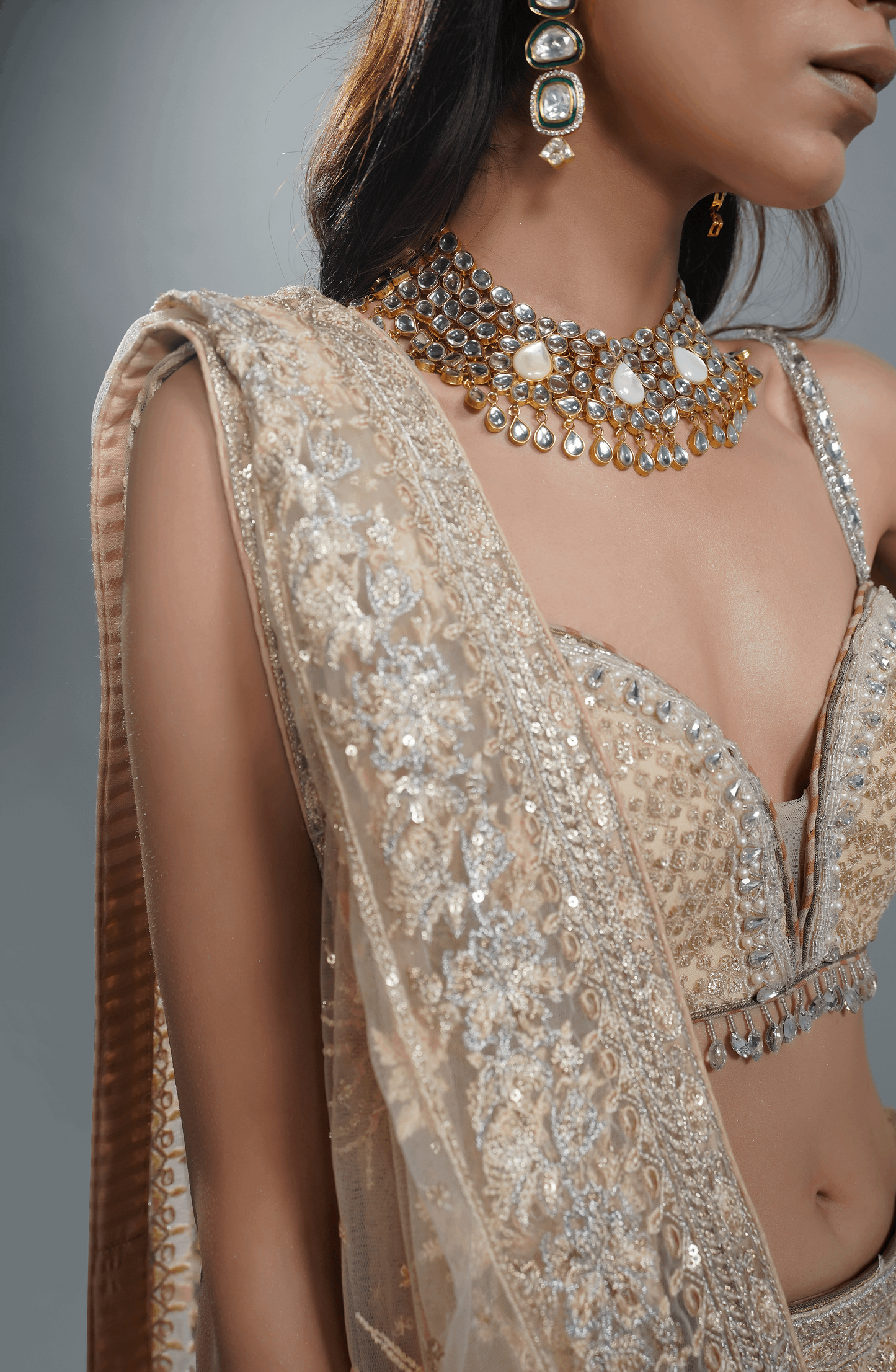 Beige Dream - Exquisite Net Lehenga Choli Outfit-Designer blouse from beige lehenga choli featuring delicate embroidery.