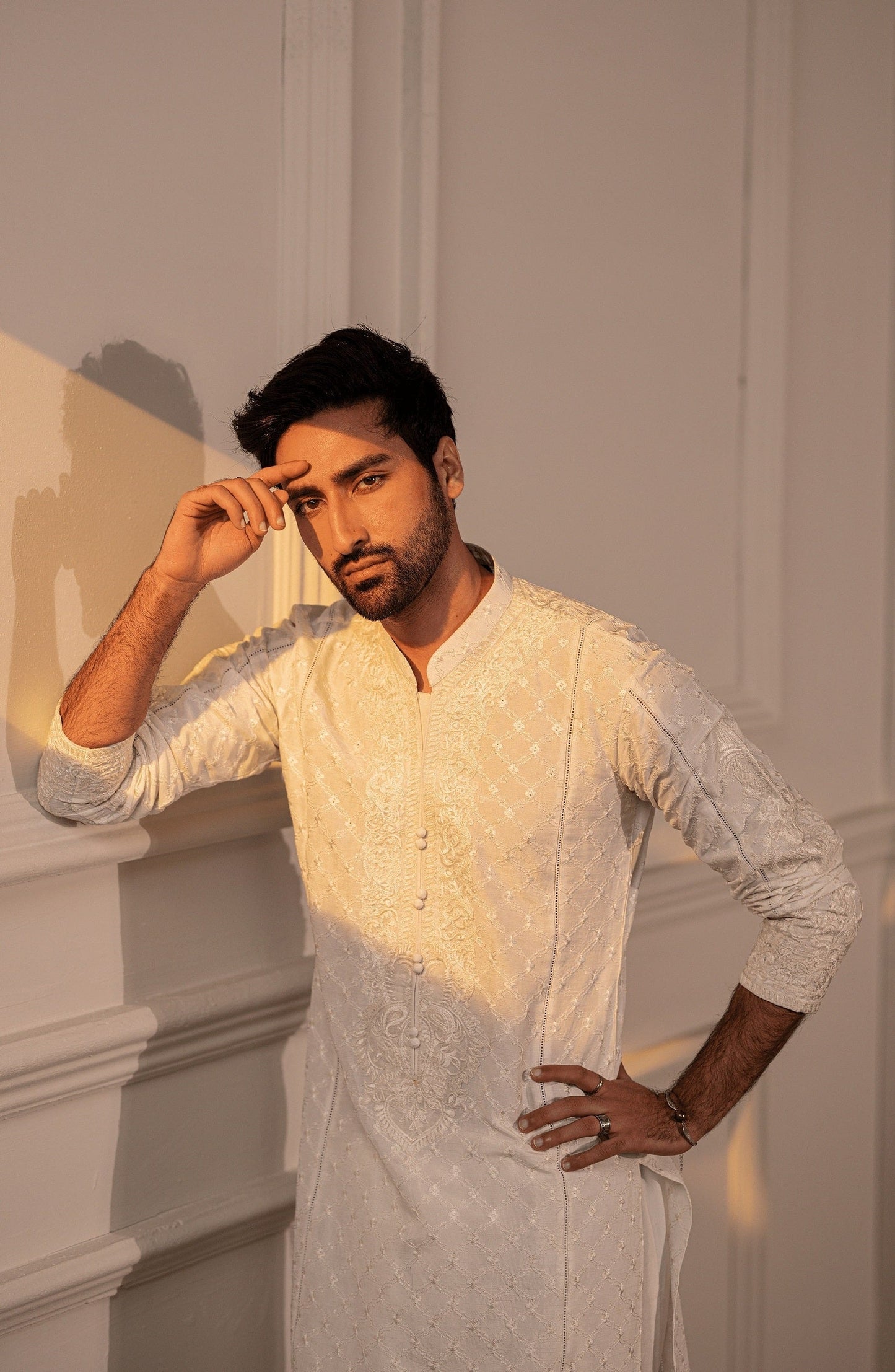 Embroidered Pakistani kurtas for formal events-Closeup embroidery work on Classic White kurta shalwar outfit.