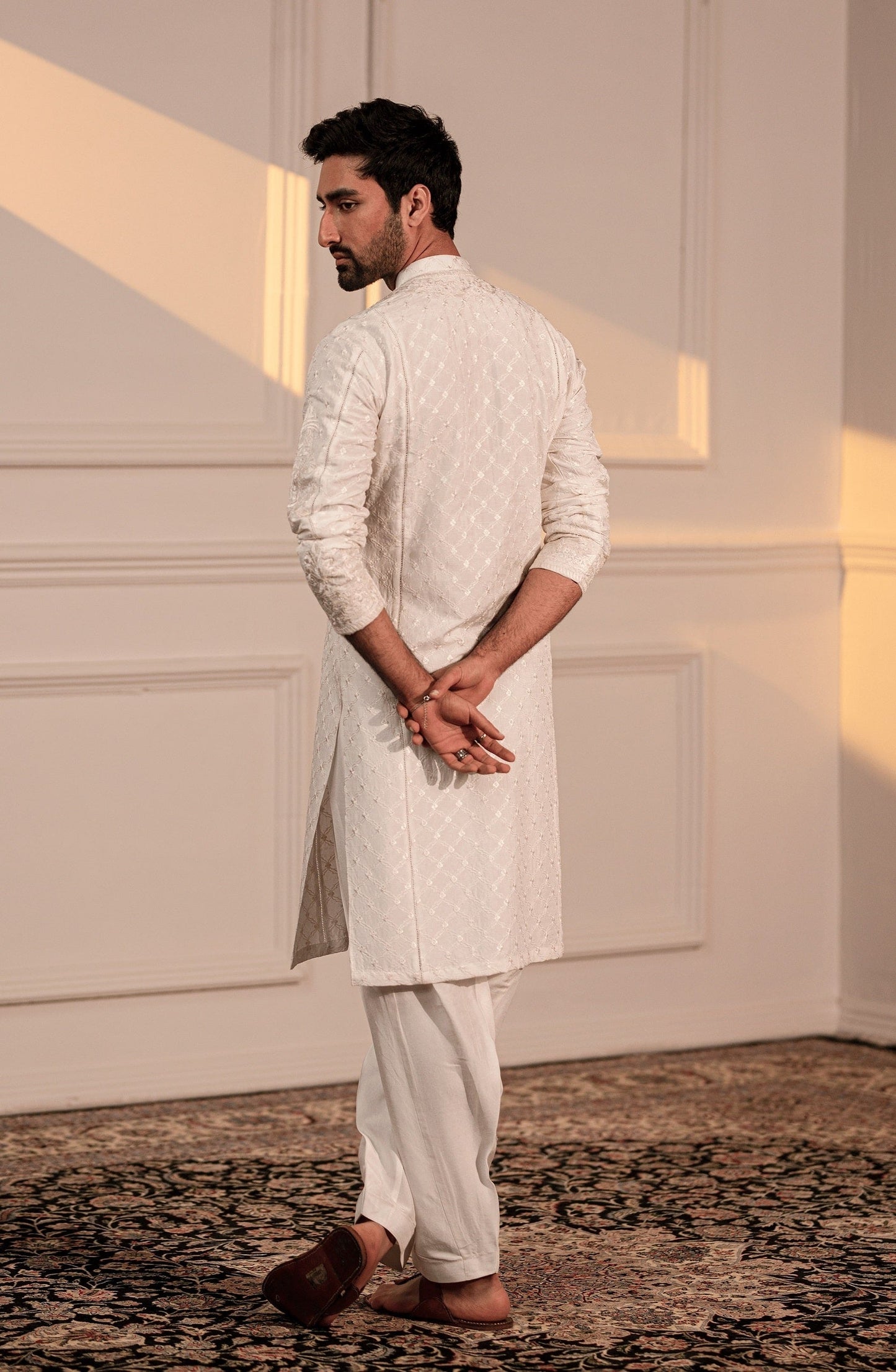 Stylish men’s Pakistani kurtas for weddings-Sleeve embroidery design on Classic White male kurta shalwar.