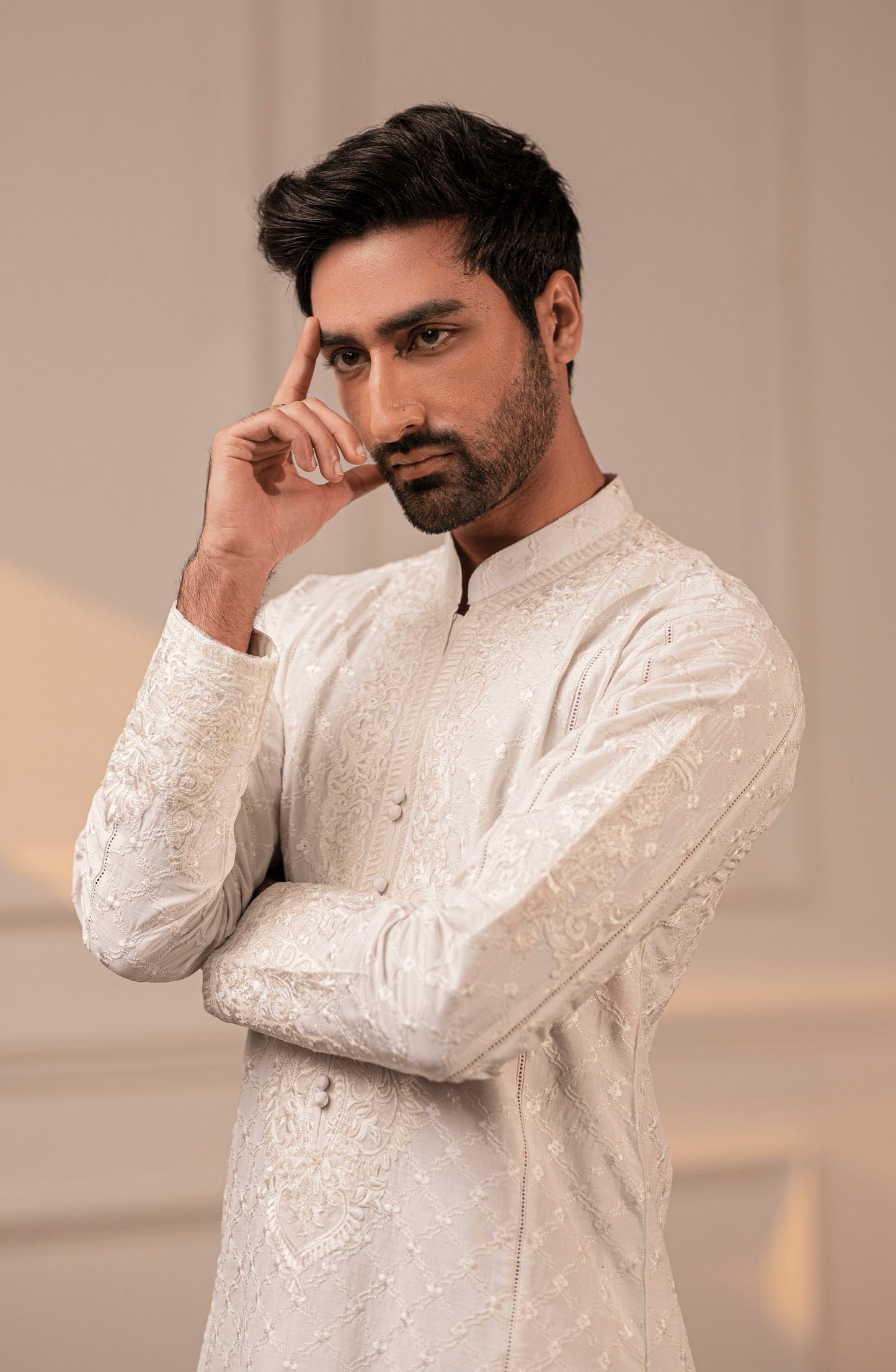 Best casual Pakistani kurtas for men-Traditional ethnic look in Classic White embroidered kurta shalwar.