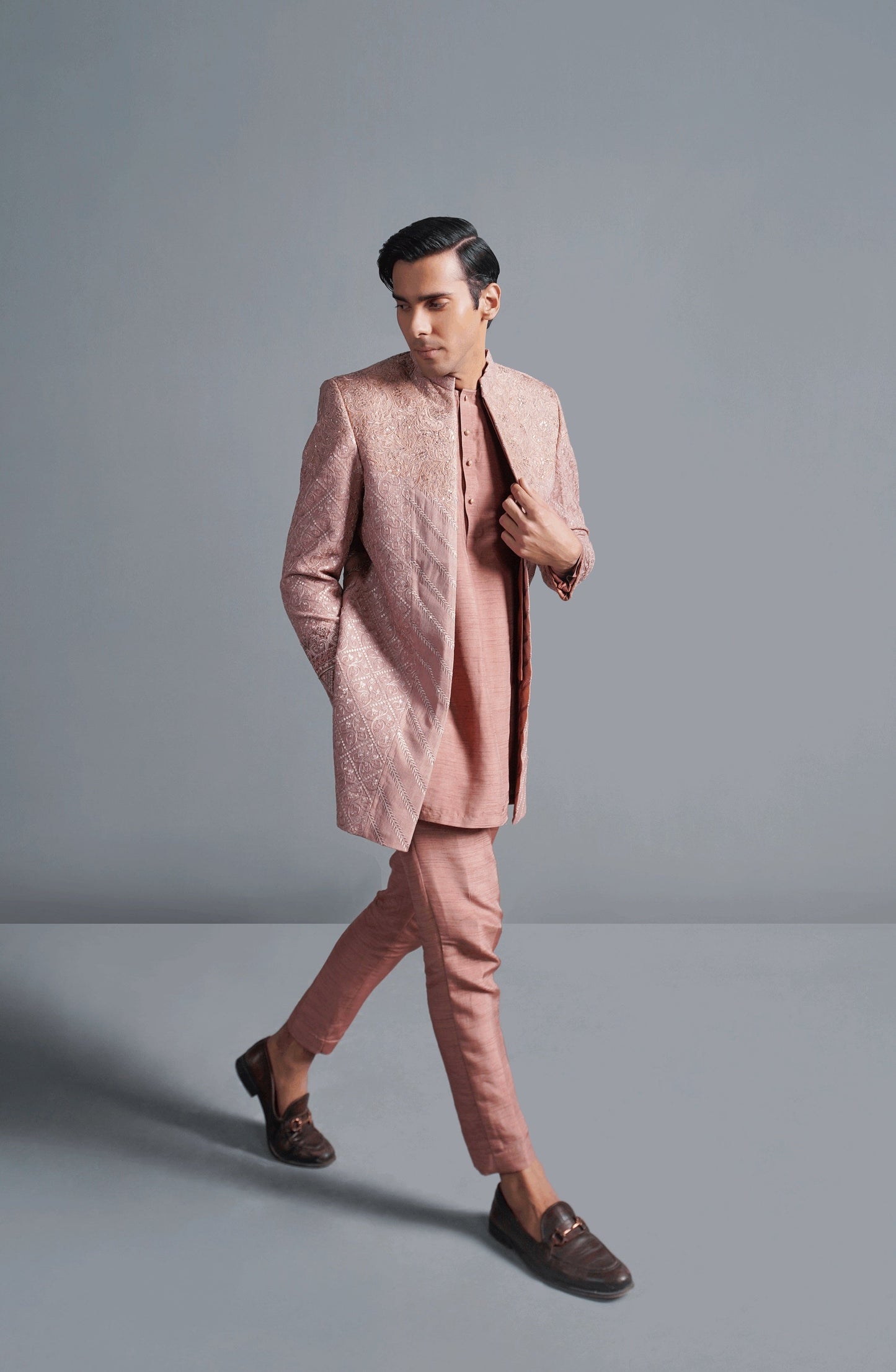 Designer sherwanis for men with intricate details-Closeup embroidery detail on coral pink cotton net sherwani for premium finish.