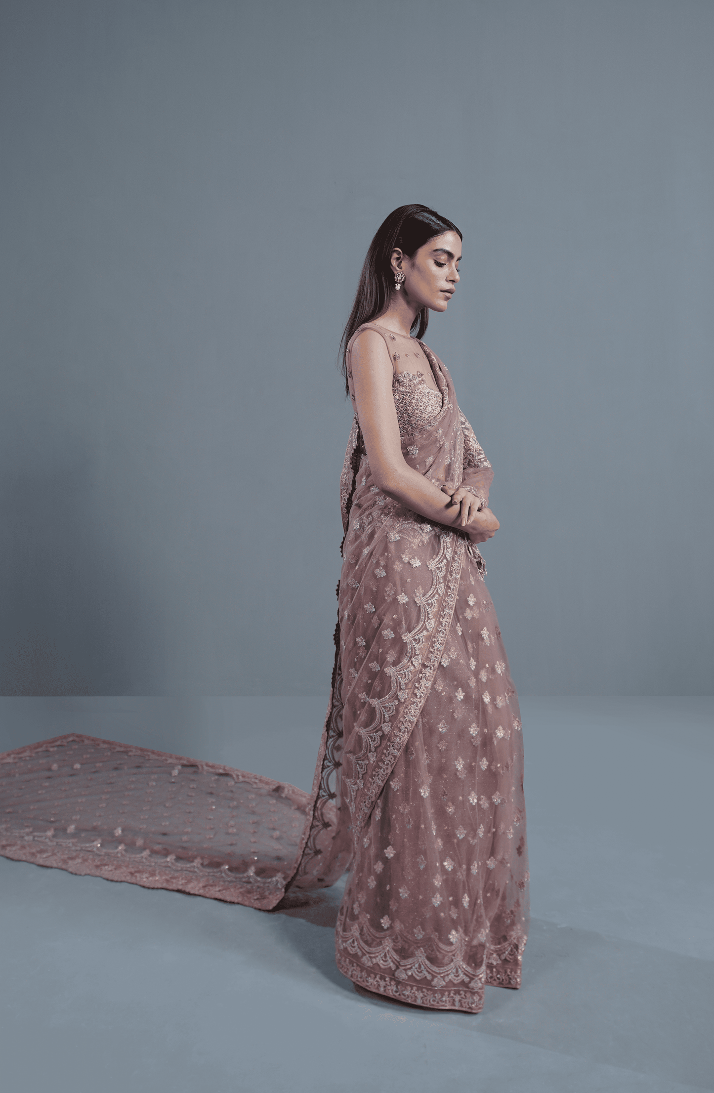 Dusty Rose Pakistani Saree by HSY online in USA-Stylish side view of embroidered net saree highlighting its graceful fall.