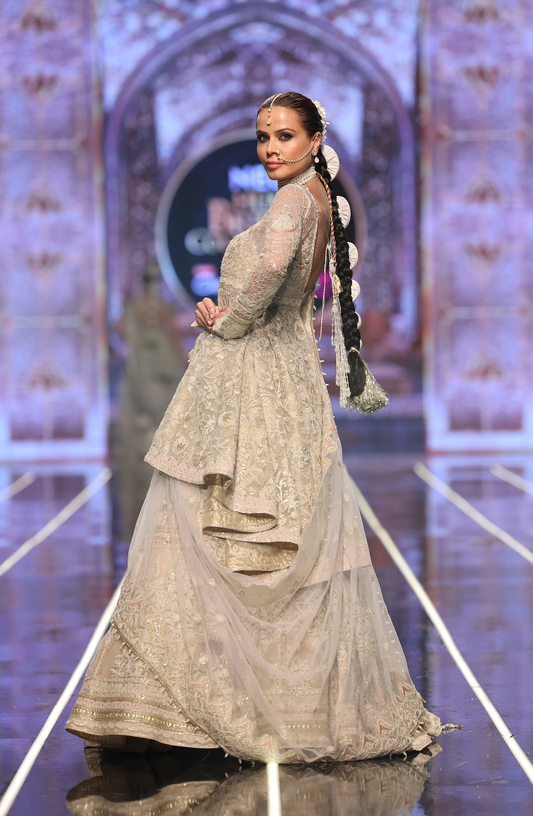 HSY High-Low Peplum With Lehenga -Side profile of designer high-low peplum paired with lehenga"