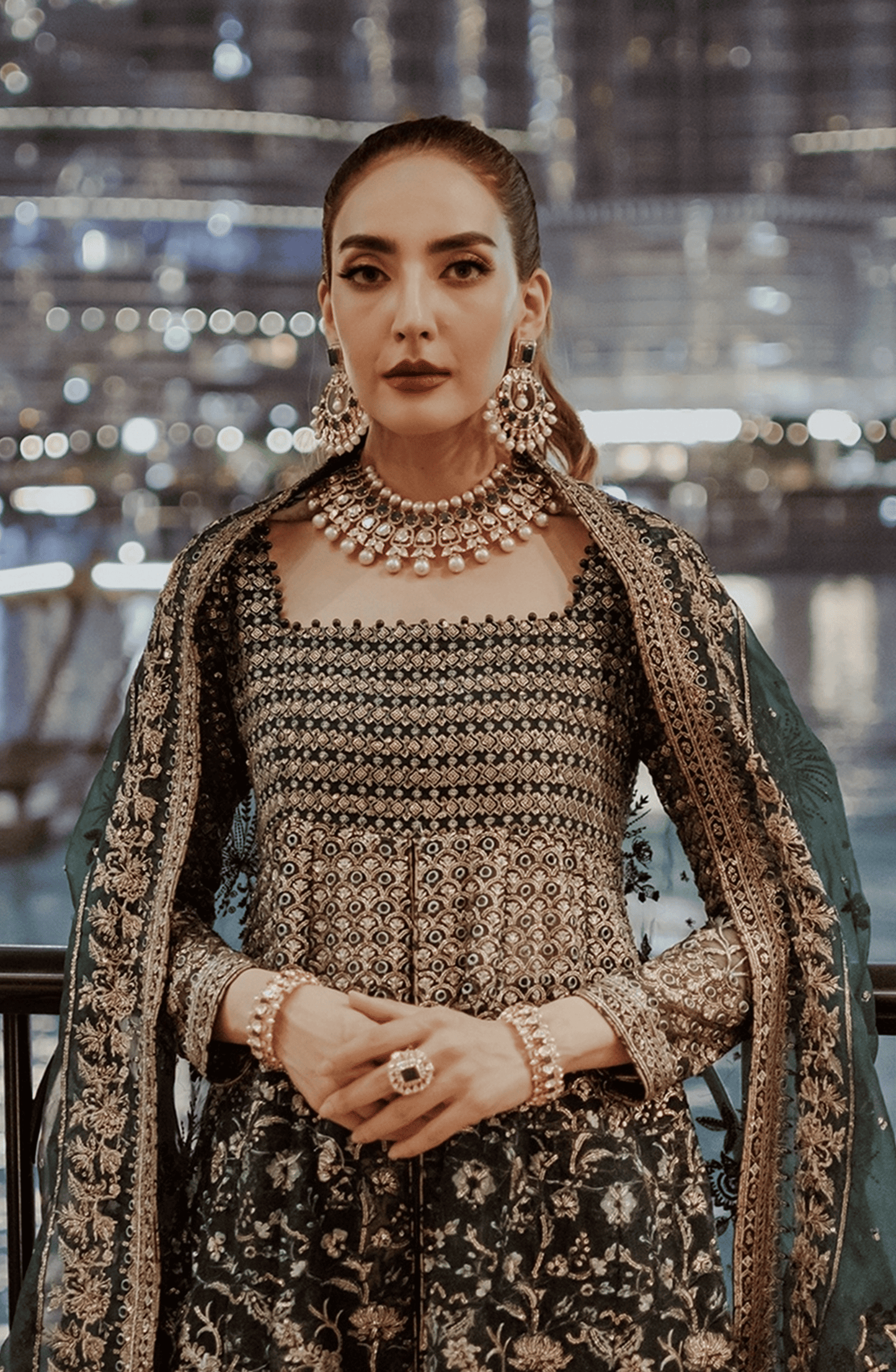 Pakistani Designers Luxury Wedding Formals by HSY-Side profile of Hoor stunning emerald green pishwas with graceful flow.