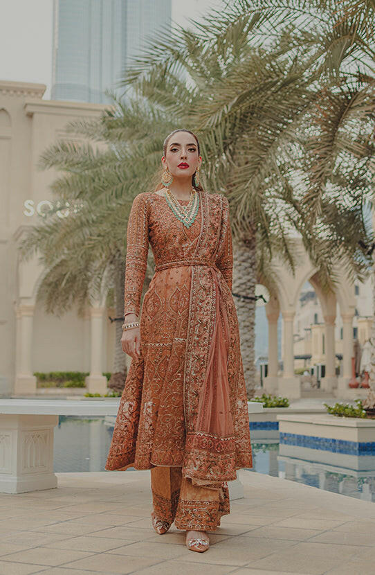 Luxury red Pishwas online USA -Traditional ethnic look styled in Jahan Ara coral pink ensemble set.