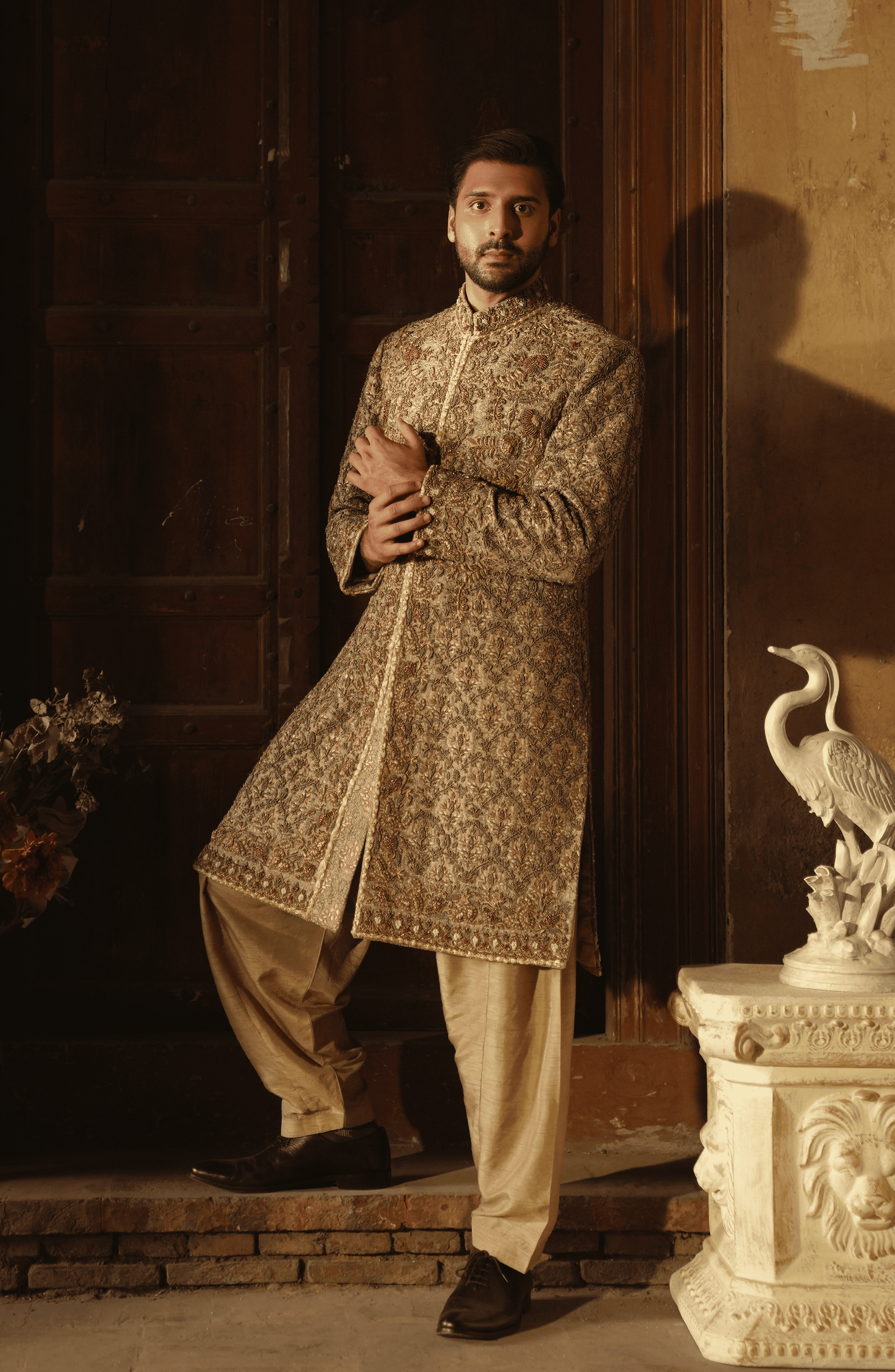 HSY | groom wear for barat-Side profile of Meer mushroom hue silk sherwani highlighting sleek fit.