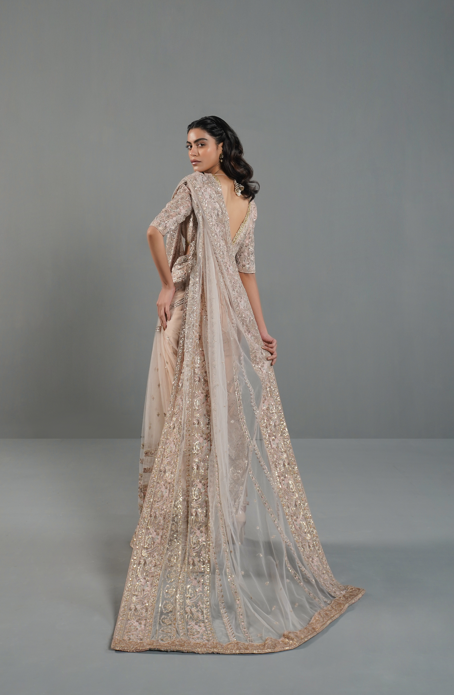 HSY Trousseau Luxury Saree for wedding and Party-Draping style of misty pink embroidered saree for a modern ethnic look.