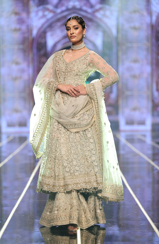 Pakistani Net pishwas paired with jamawar sharara -Front view of net pishwas with jamawar sharara for weddings