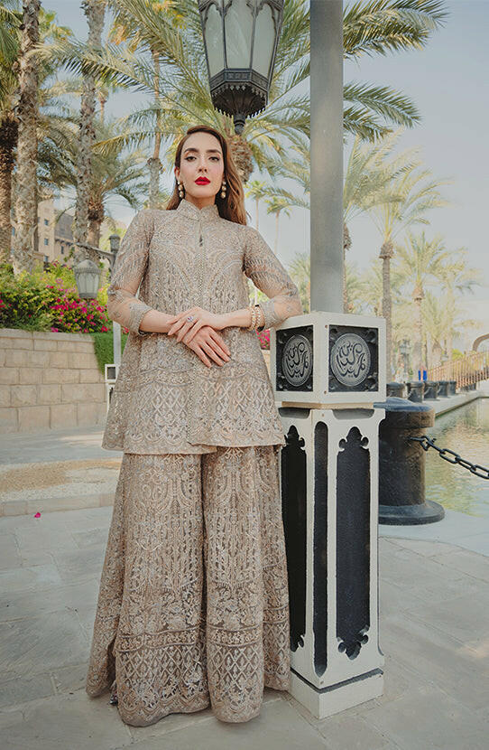 Noor-un-Nisa - Elegance Beige EnsembleElegant Noor-un-Nisa beige ensemble with delicate embroidery, front design.