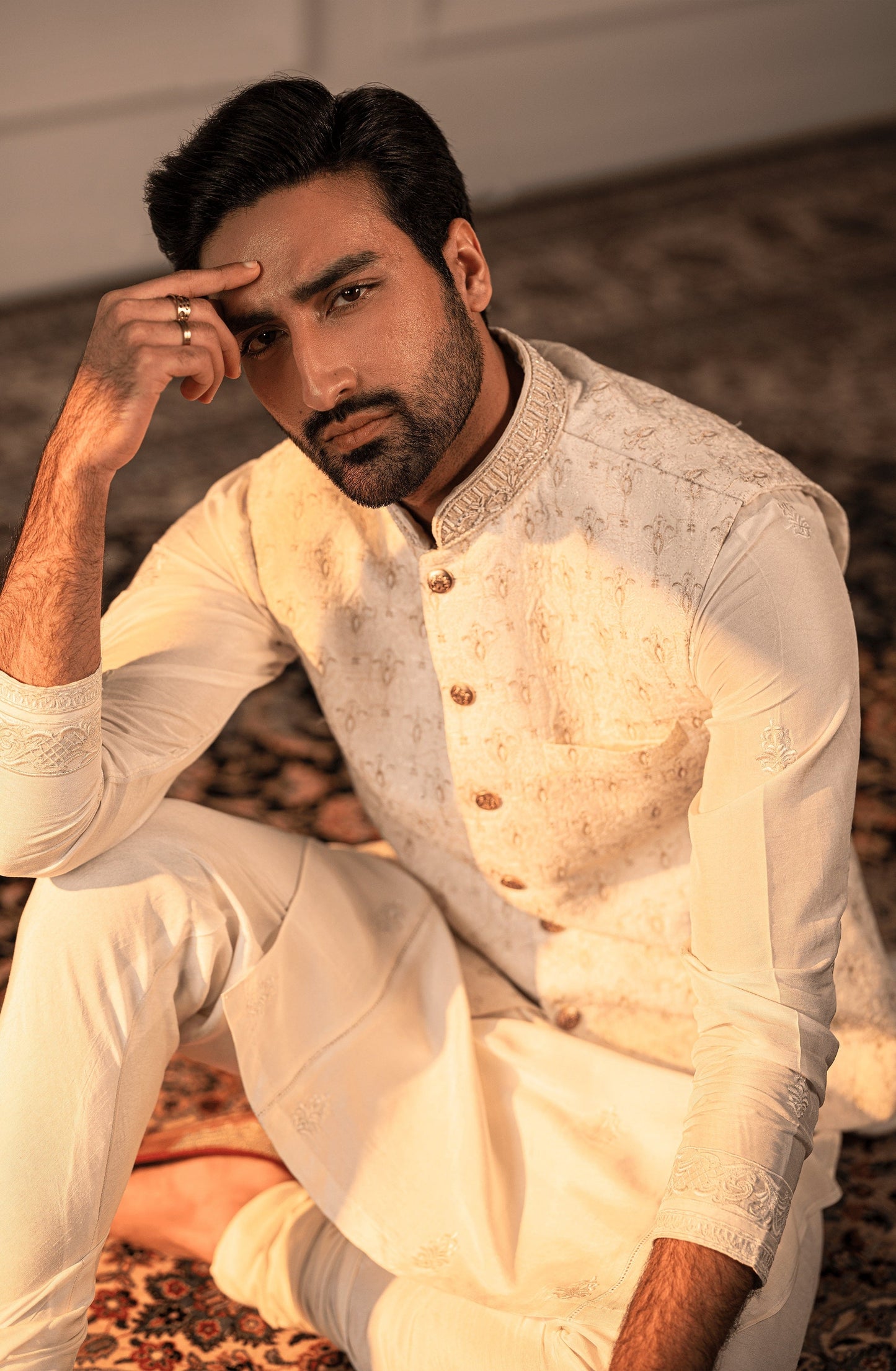 Detailed neckline design of Opulent White embroidered silk formal kurta.