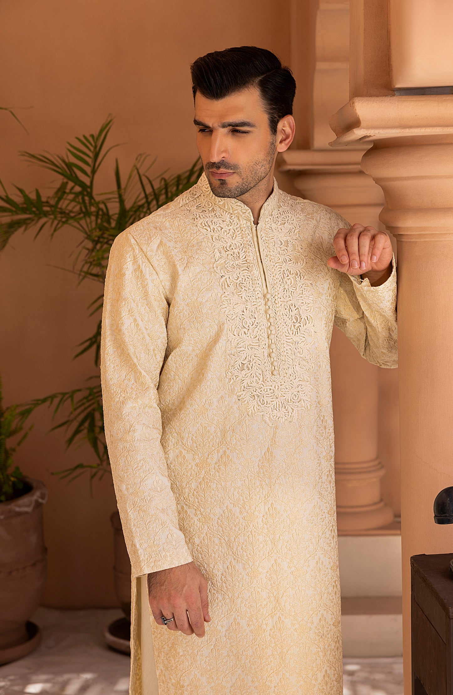 Closeup of embroidery on pearl white kurta churidaar