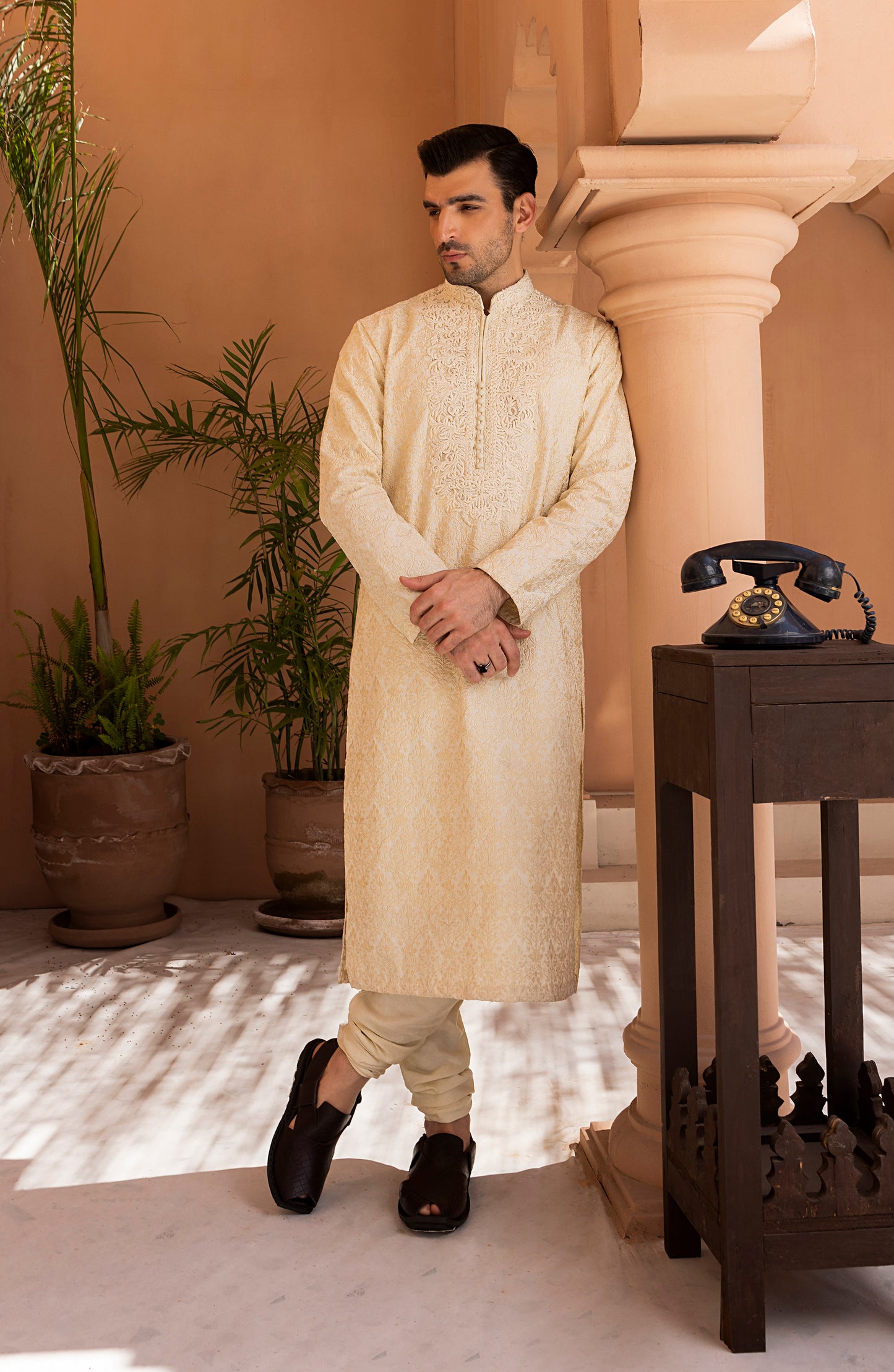 Front view of pearl white embroidered kurta churidaar set