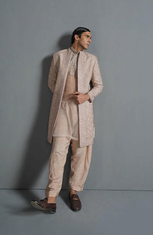 Pakistani designer sherwani Online-Full outfit view of primrose pink embroidered sherwani with matching bottoms.