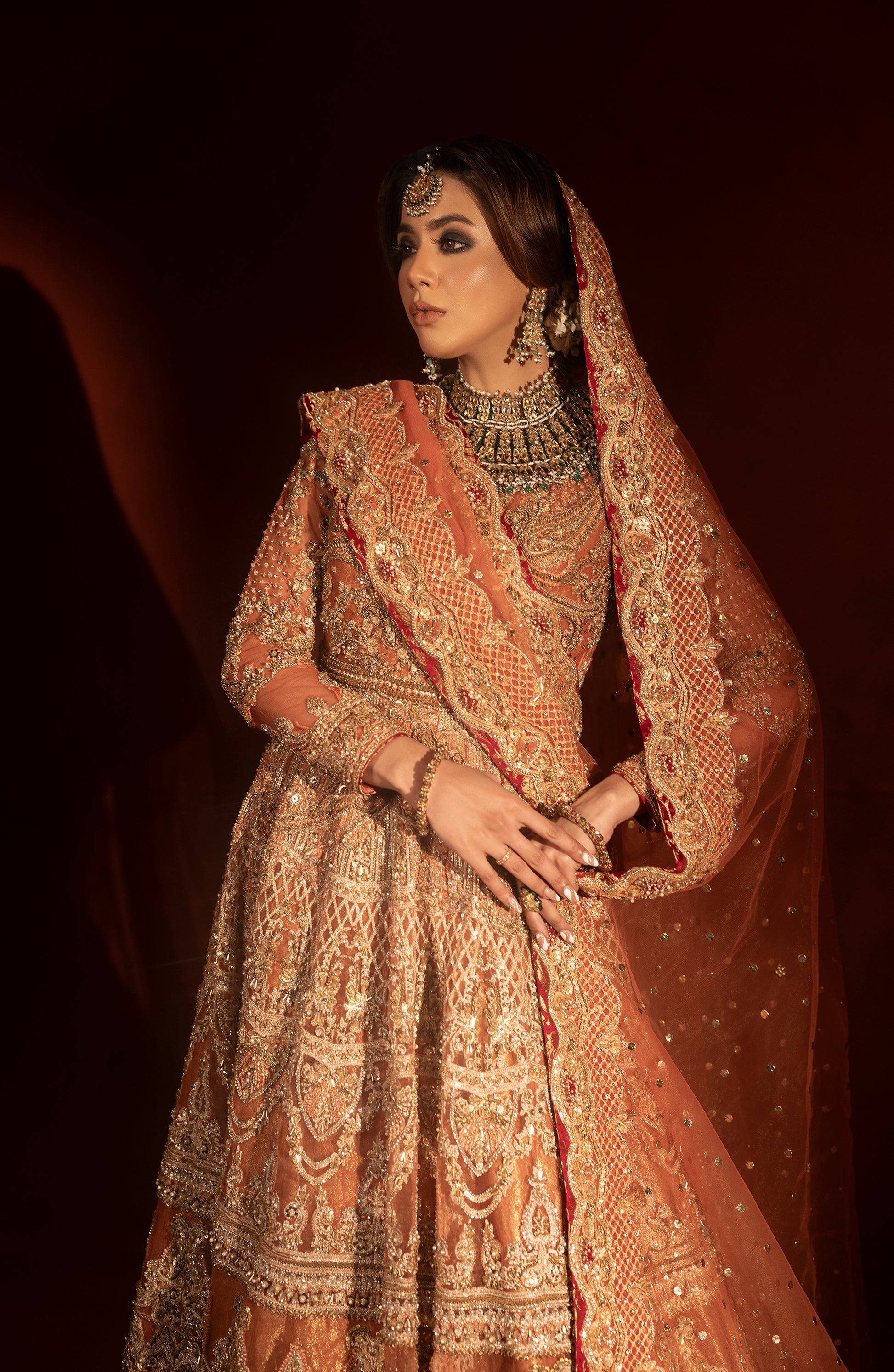 Dupatta styling with rust orange pishwas bridal lehenga set