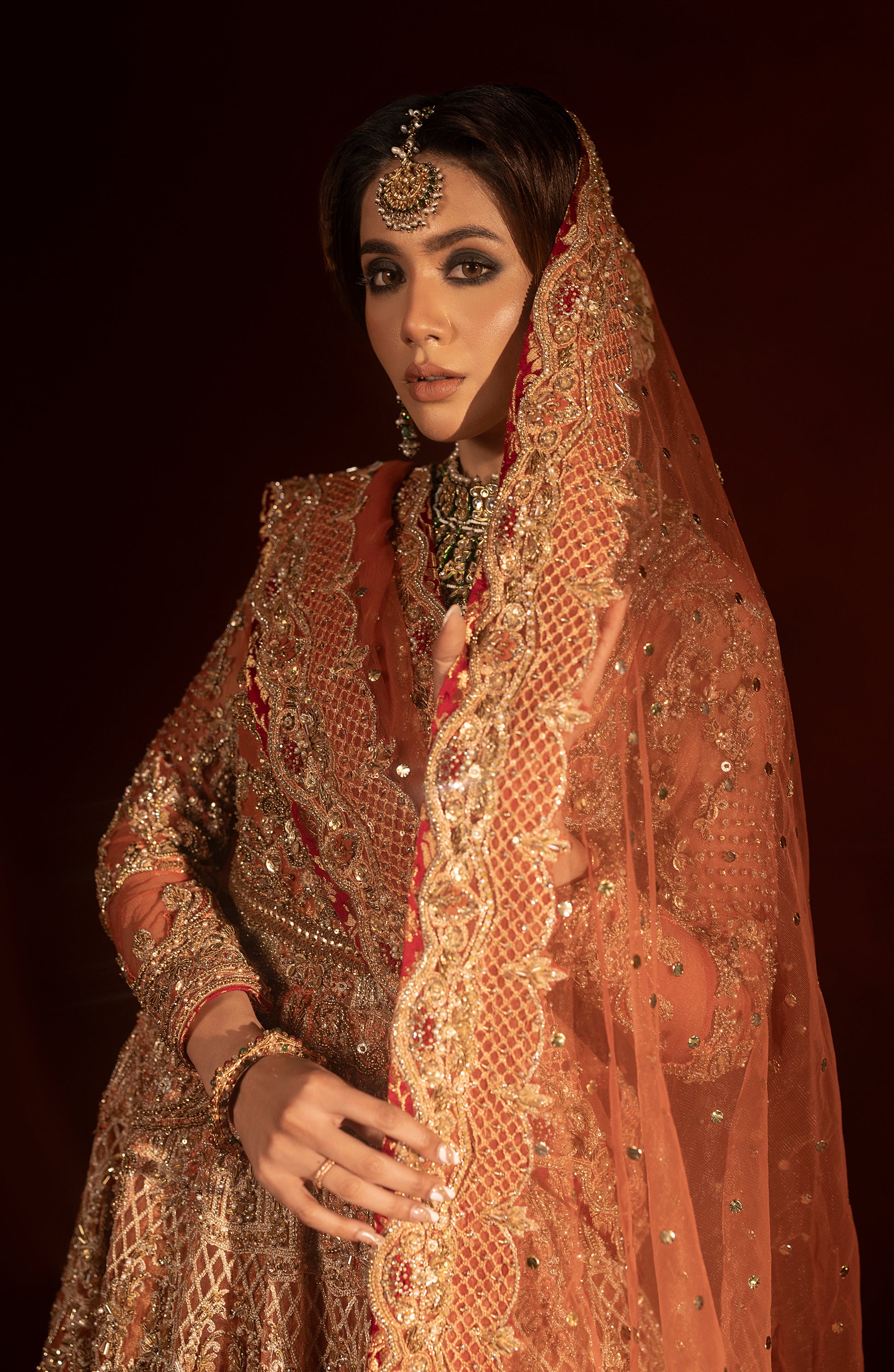 "amawar lehenga detail in rust orange bridal set