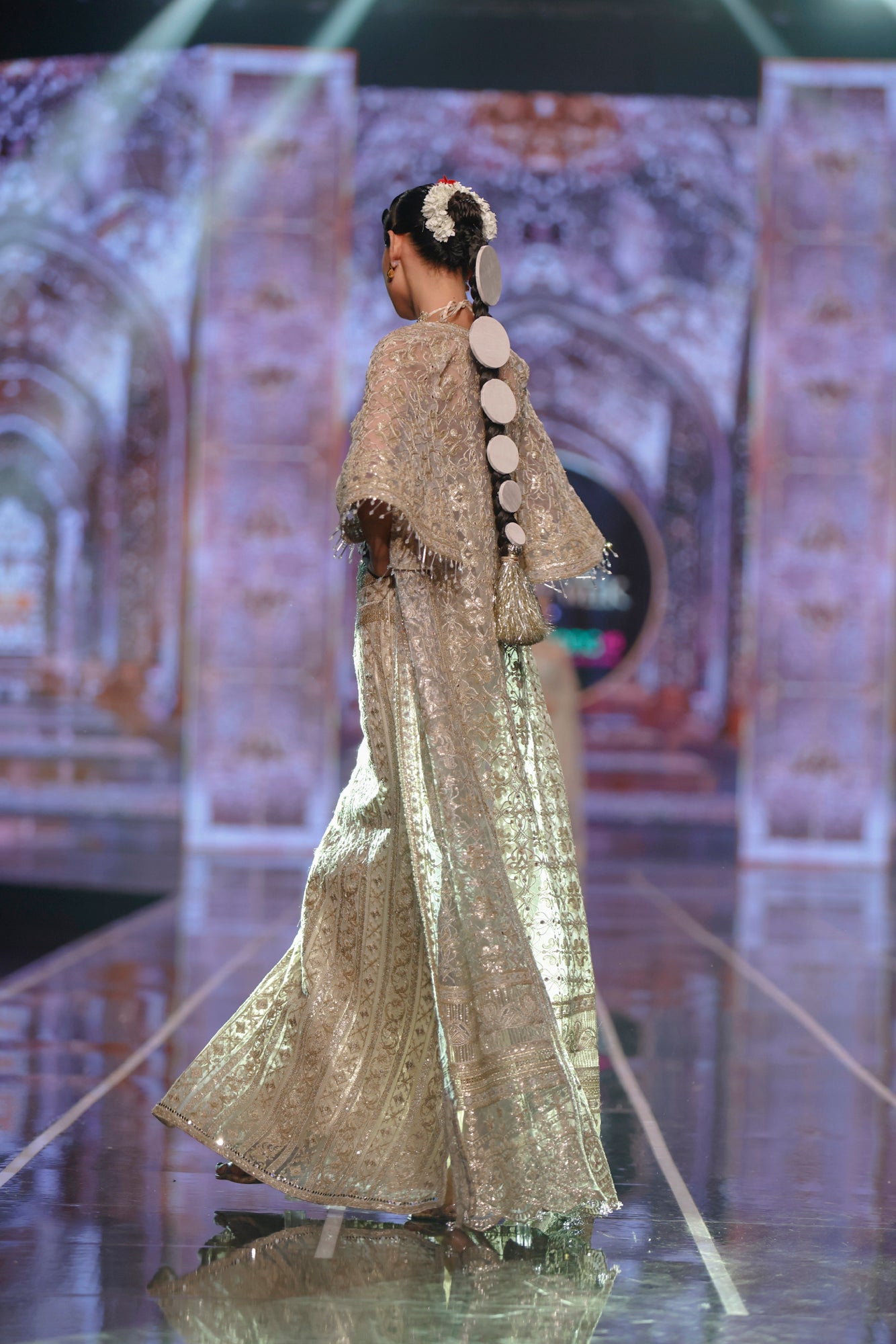 HSY Skirt & Halter Blouse Net Ensemble With Jacket -Side profile of skirt and halter blouse net ensemble styled with jacket