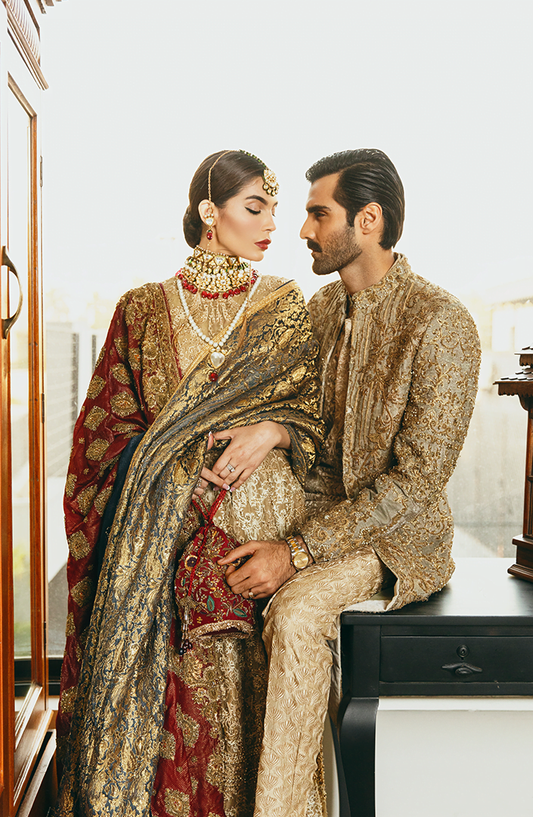 Embroidered Beige Kurta, Paired with a fully embellished Gold Sherwani