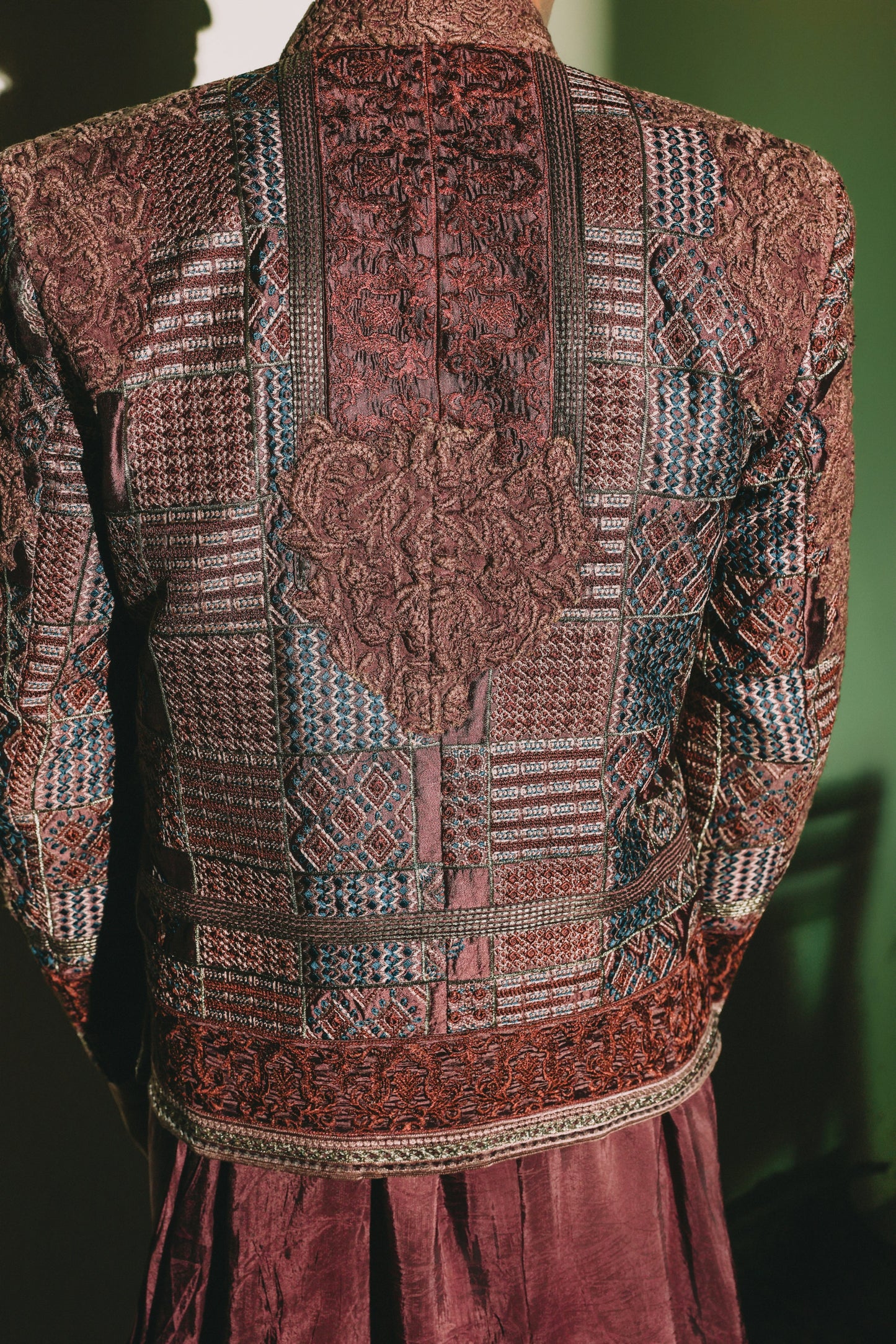 Patterned garment with intricate designs on a dark background
