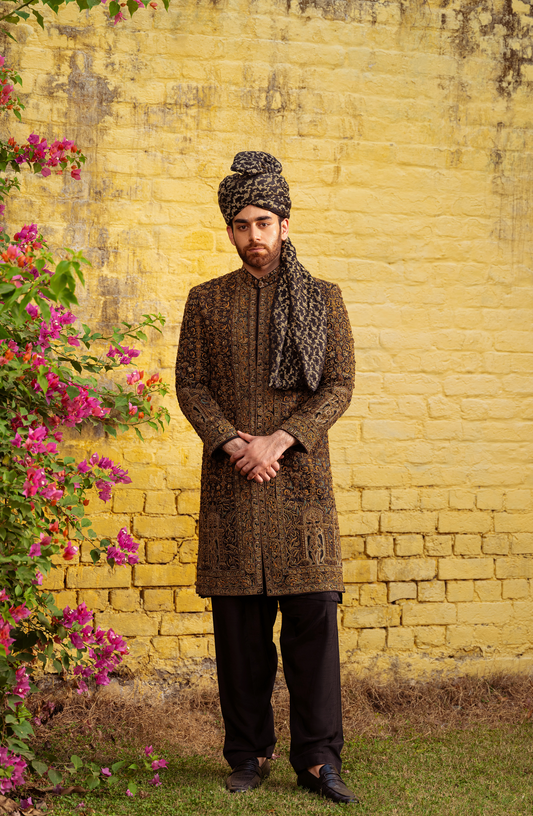 Dastaan - Exquisite Black Silk Sherwani adorned with Antique Gold, Teal & Beige Embroidery