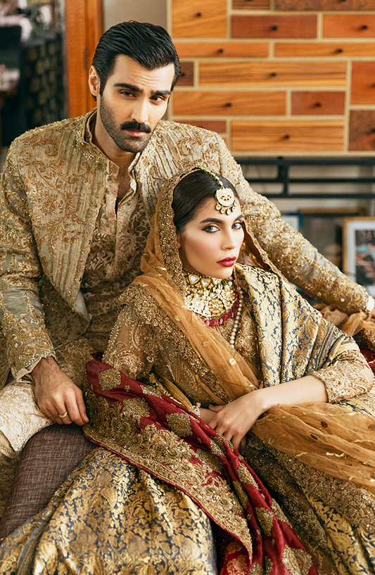 Embroidered Beige Kurta, Paired with a fully embellished Gold Sherwani