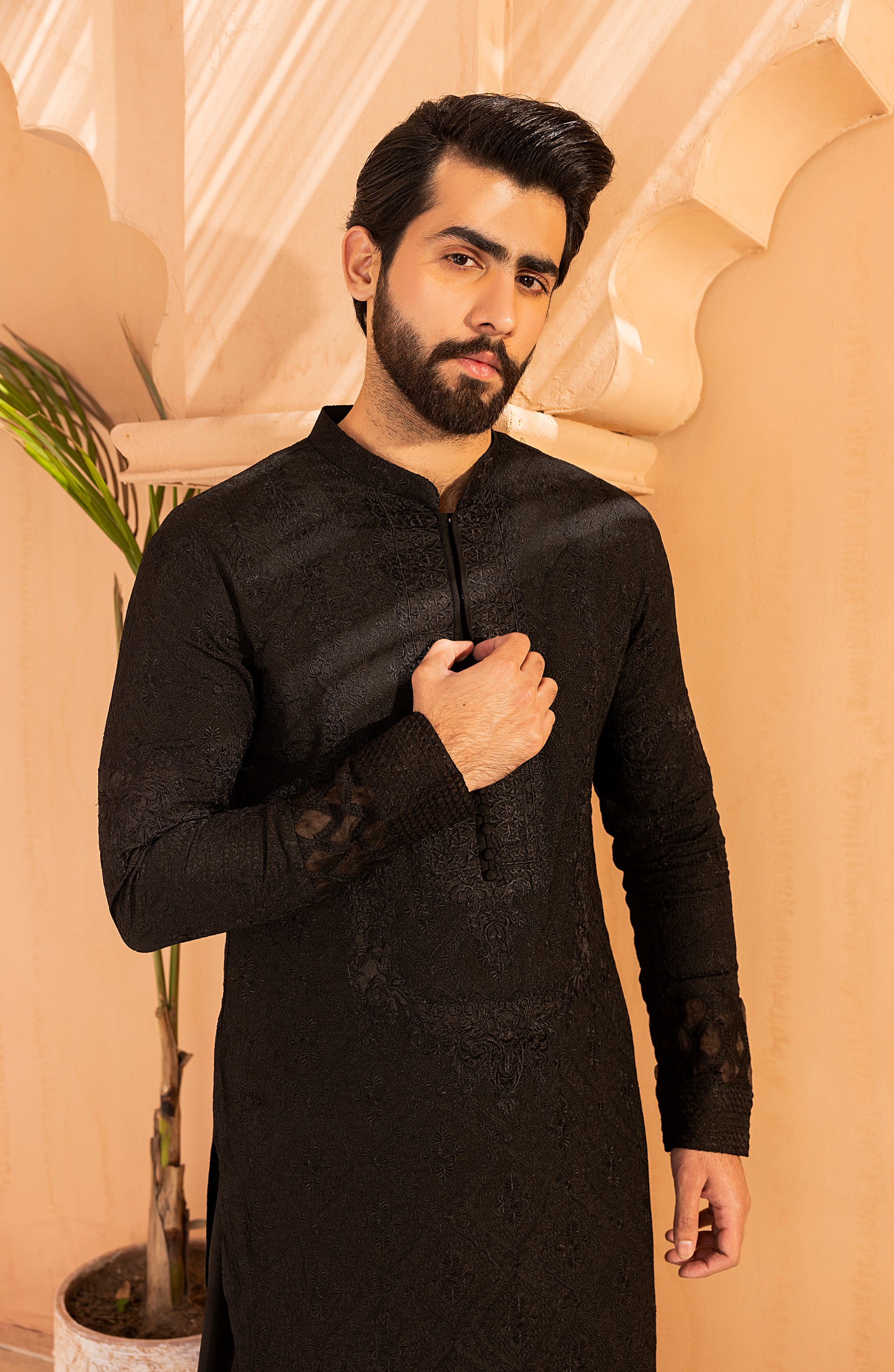 Back design of black kurta shalwar kameez with embroidery