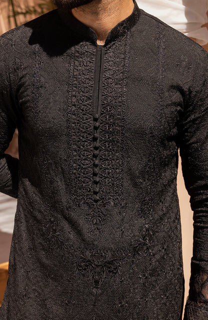 Detailed embroidery work on black kurta shalwar kameez outfit