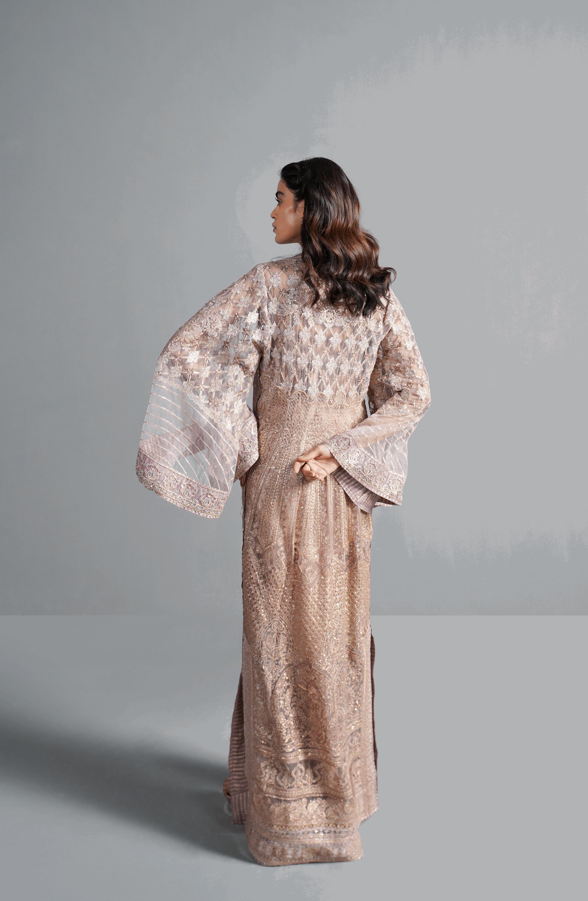 Champagne Pink - Beautiful Embroidered Ensemble-Back design of blouse from champagne pink embroidered ensemble with stylish finish.