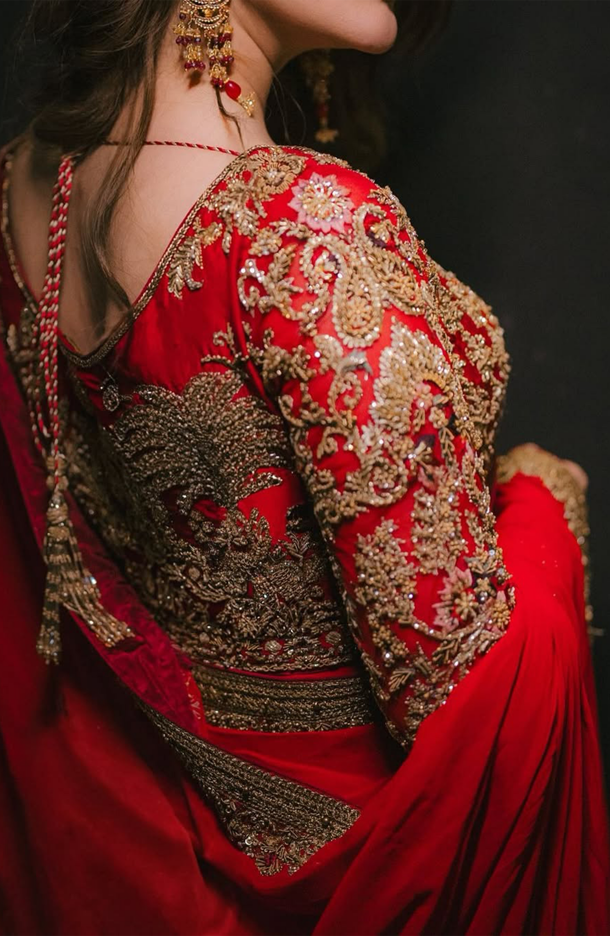 Back design of chiffon saree styled with gold borders and blouse