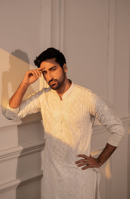 Embroidered Pakistani kurtas for formal events-Closeup embroidery work on Classic White kurta shalwar outfit.