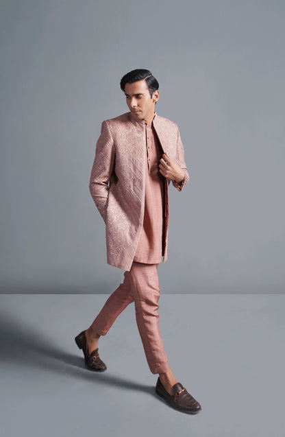 Designer sherwanis for men with intricate details-Closeup embroidery detail on coral pink cotton net sherwani for premium finish.