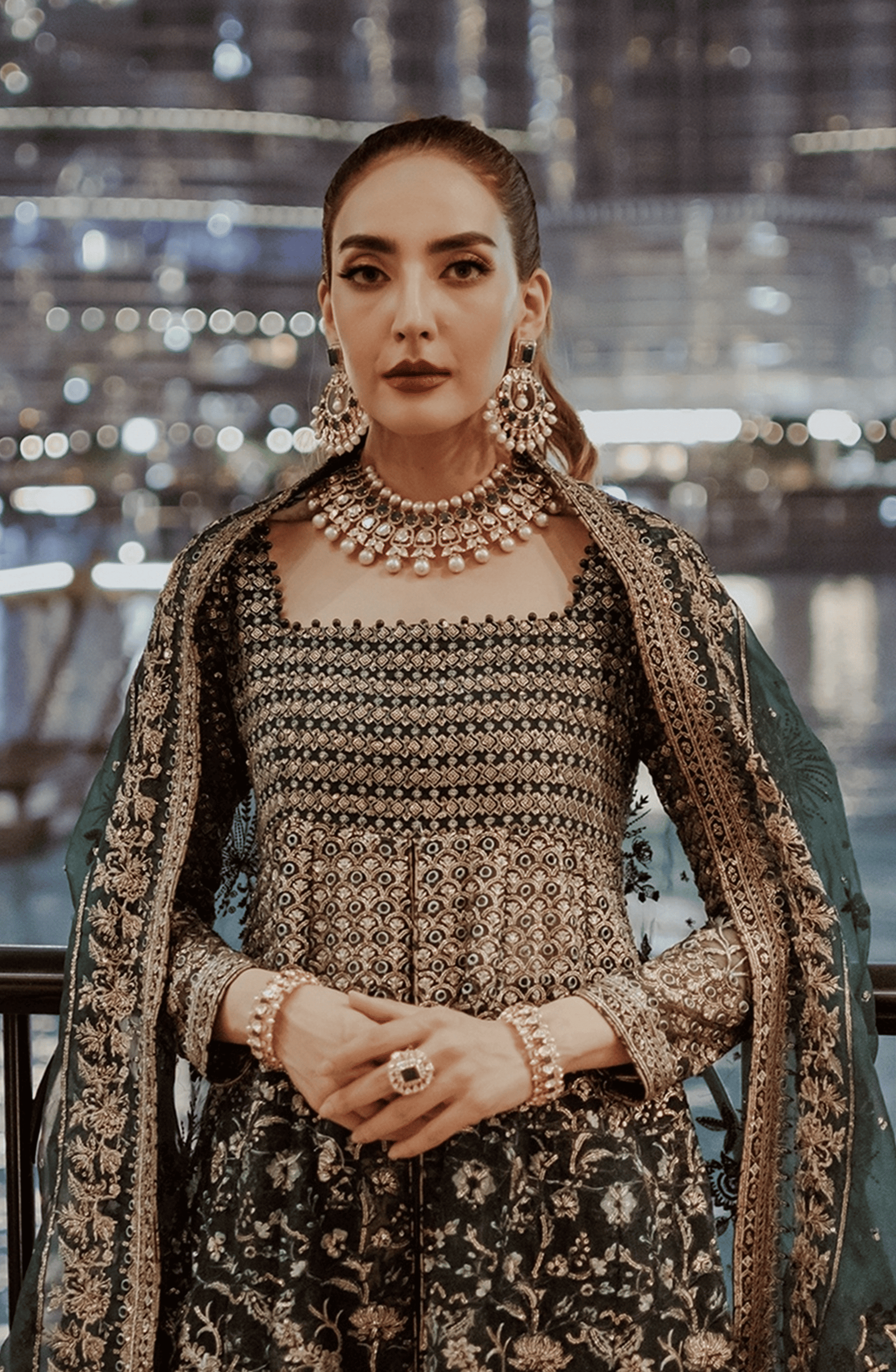 Pakistani Designers Luxury Wedding Formals by HSY-Side profile of Hoor stunning emerald green pishwas with graceful flow.