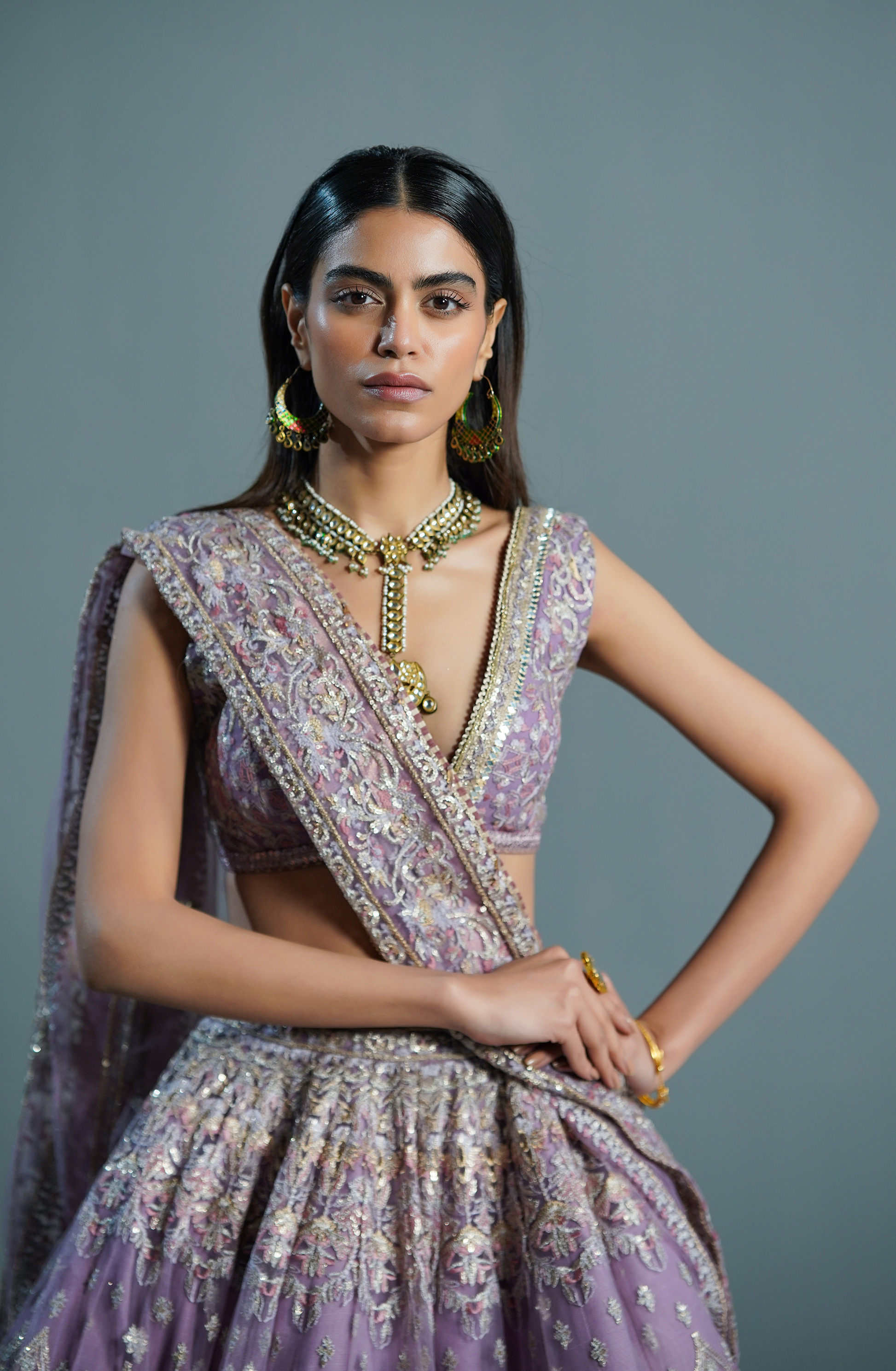 Designer lehenga choli online-Designer blouse of lilac breeze lehenga choli featuring intricate patterns.