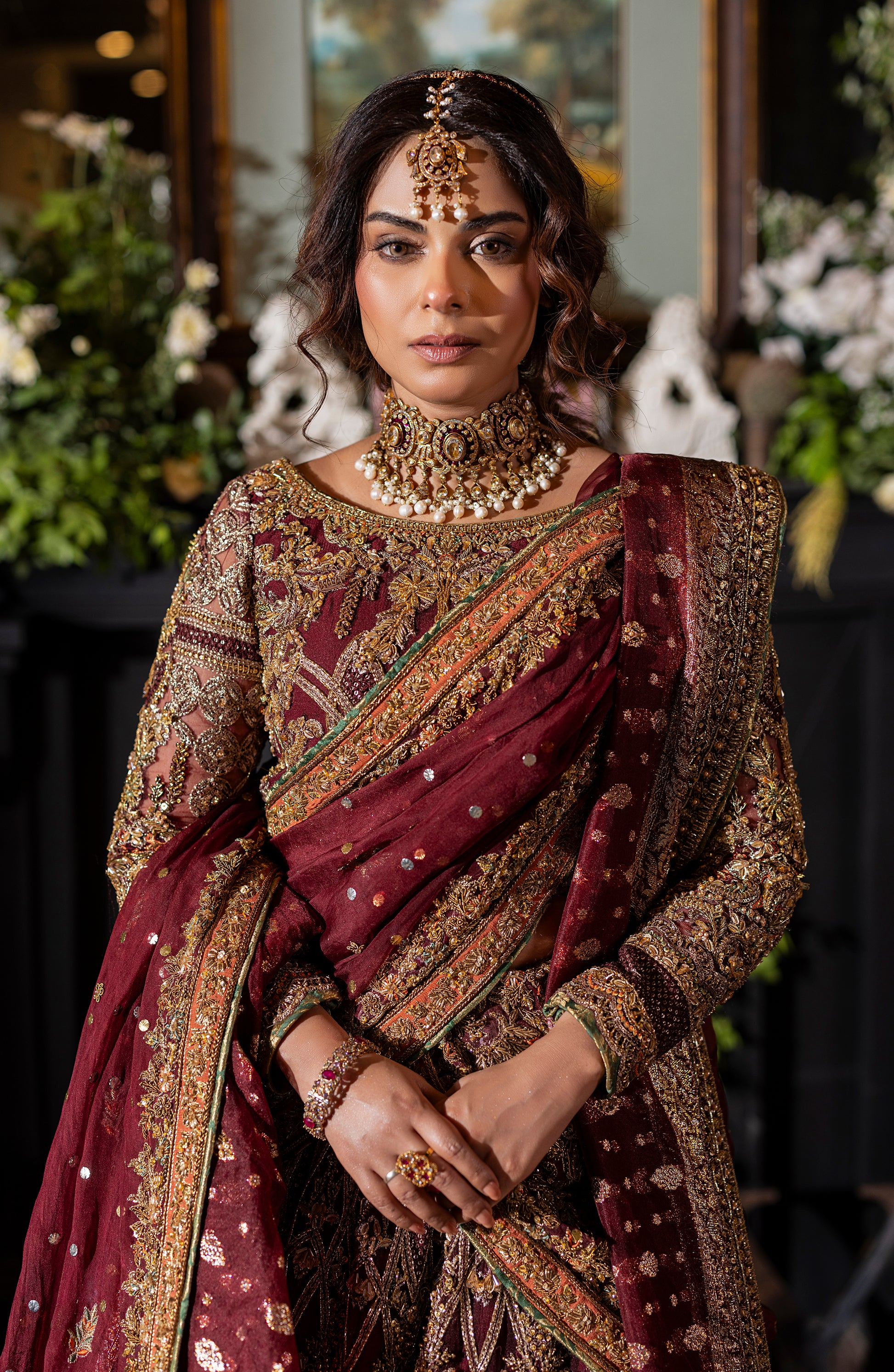 Front view of maroon choli lehenga set with mukesh dupatta