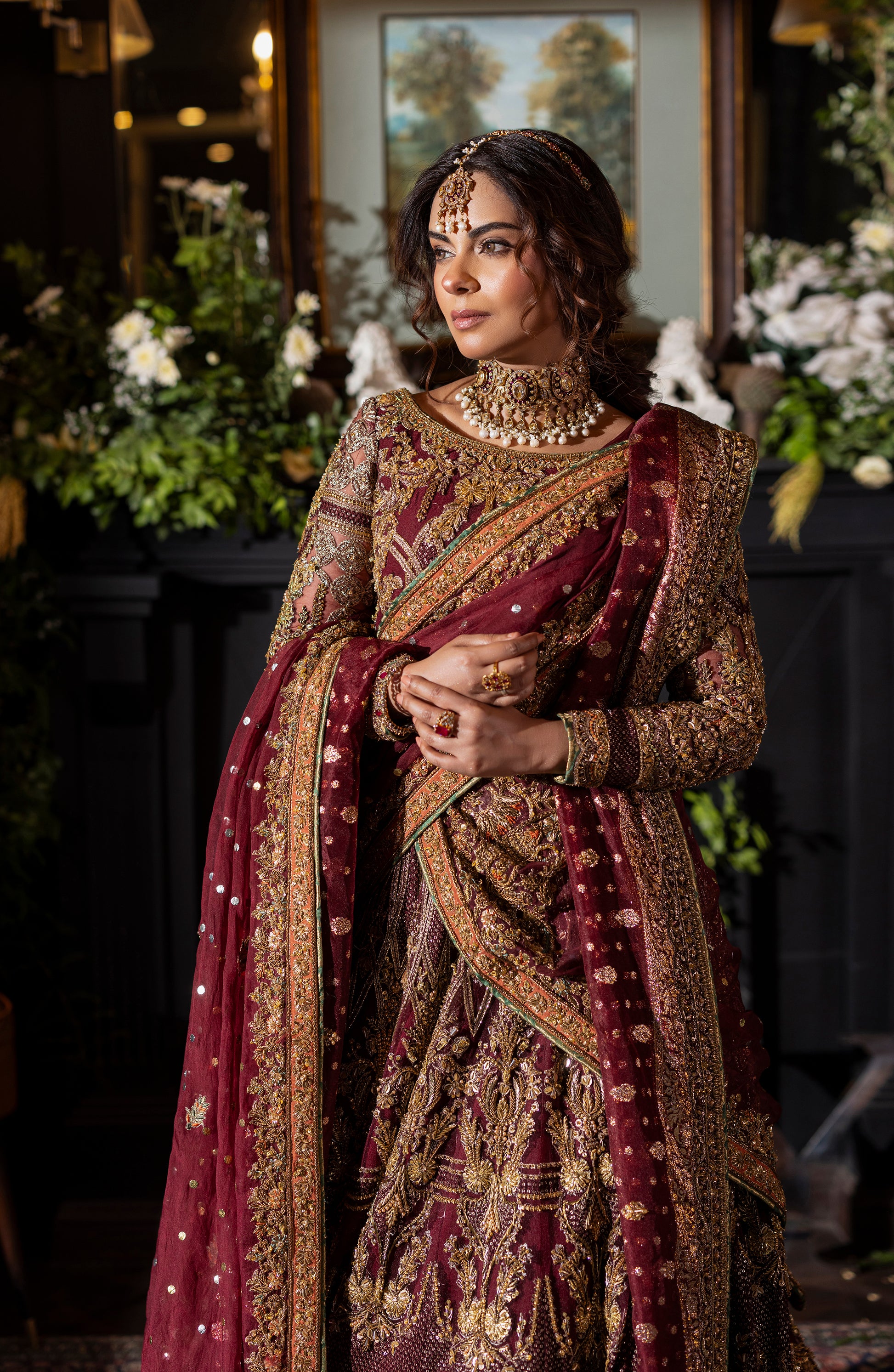 Full view of maroon choli lehenga with embroidered dupatta