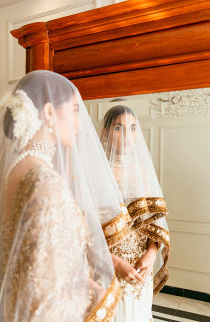 Bridal Scoop-back Mermaid Gown with a Trail and Net Mukesh Veil-Model wearing Meherbano Mermaid Gown with Mukesh Veil