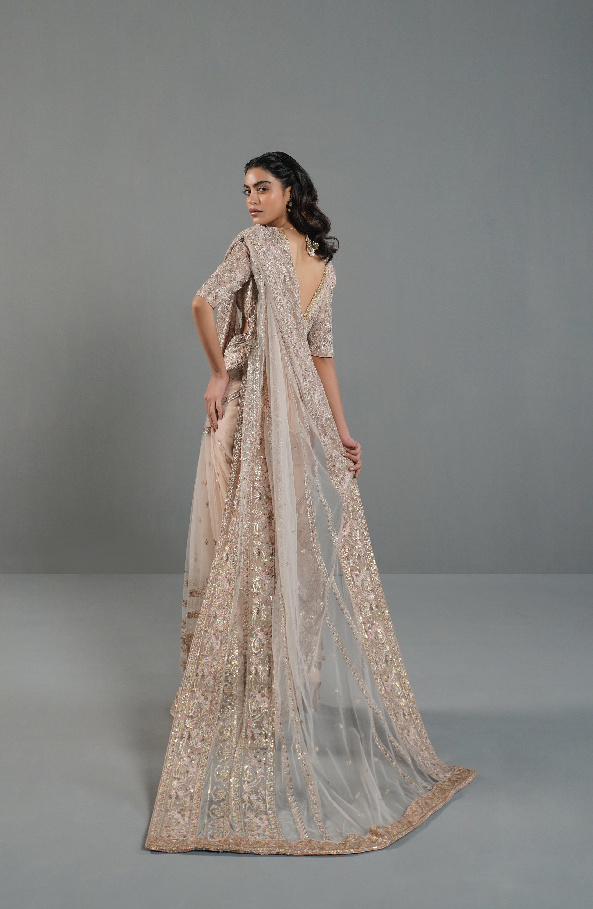 HSY Trousseau Luxury Saree for wedding and Party-Draping style of misty pink embroidered saree for a modern ethnic look.