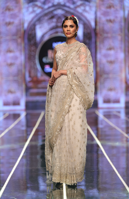 Pakistani bridal saree online by HSY-Front view of elegant net saree with cap-sleeve blouse and petticoat