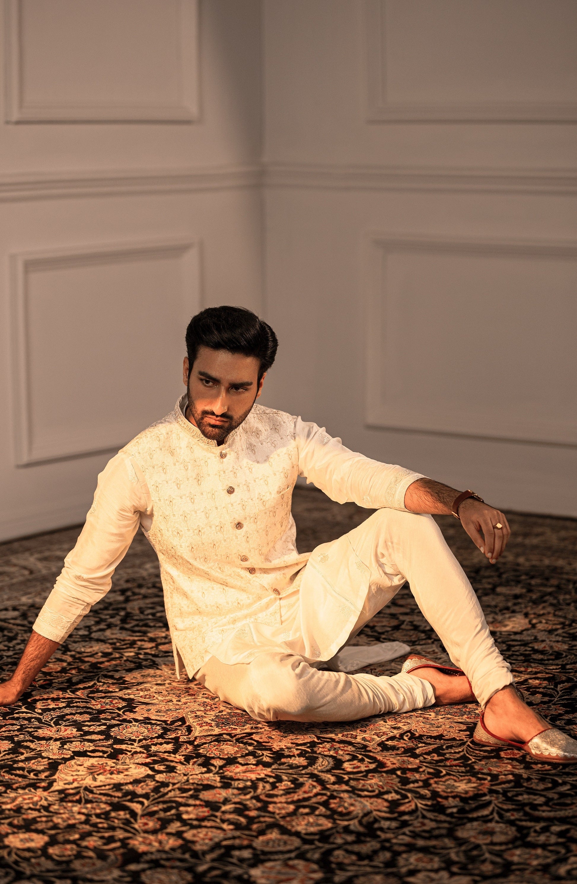 Pakistani designer kurta for men-Intricate handwork closeup on Opulent White embroidered silk kurta.