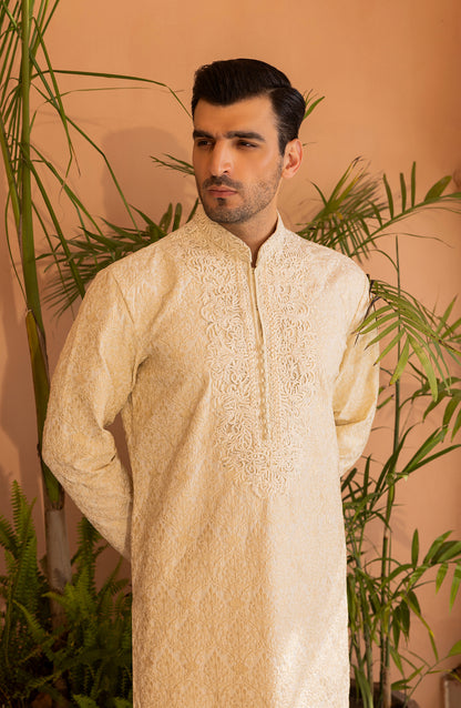 Side profile of pearl white embroidered kurta with churidaar