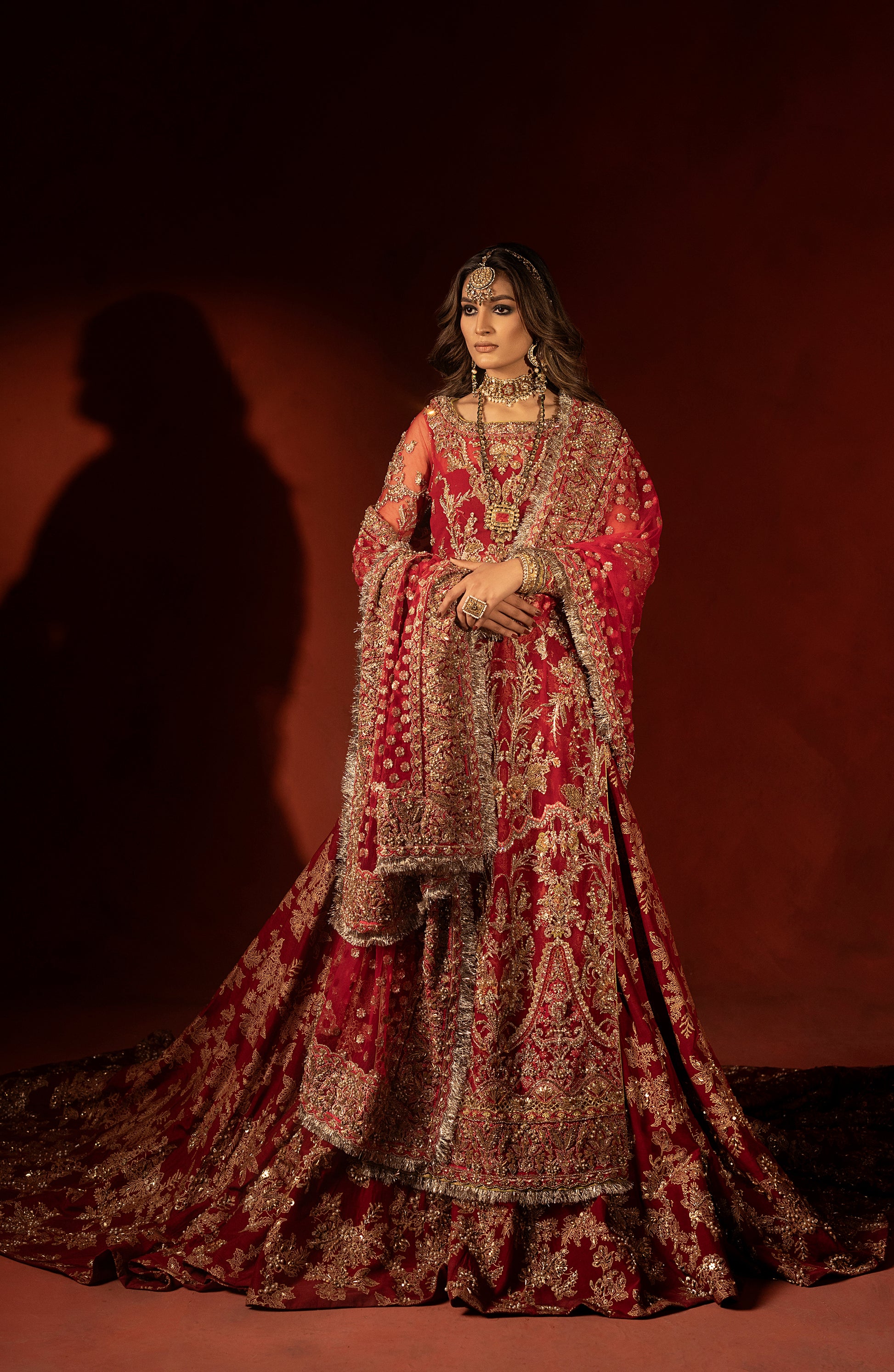 Back design of raspberry red bridal trail lehenga outfit