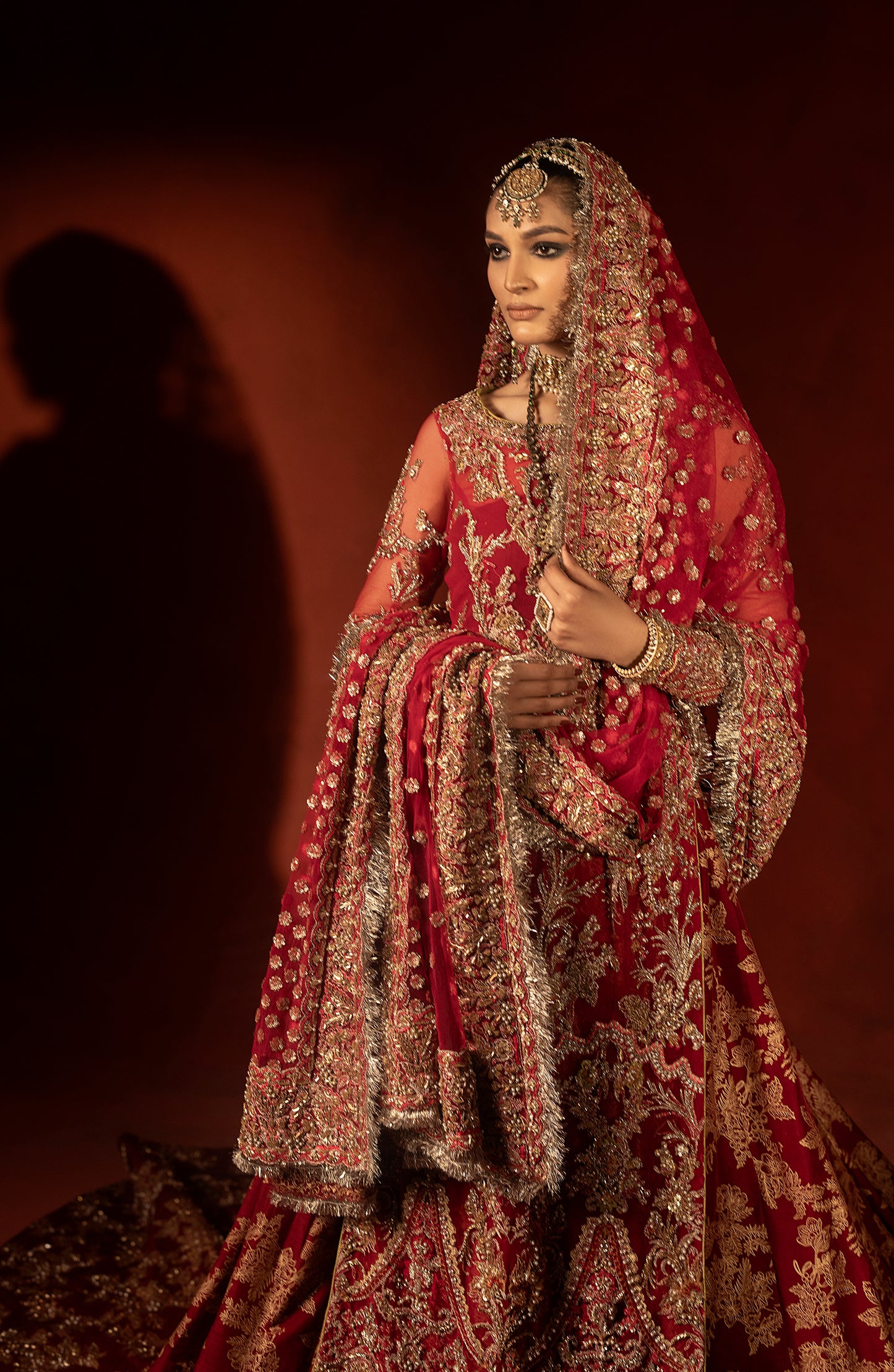 Embroidery details on raspberry red bridal trail lehenga blouse