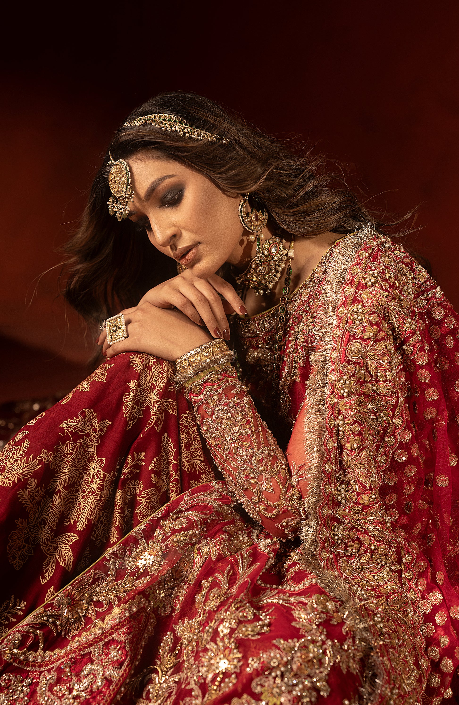 Front view of raspberry red bridal trail lehenga set with shirt blouse