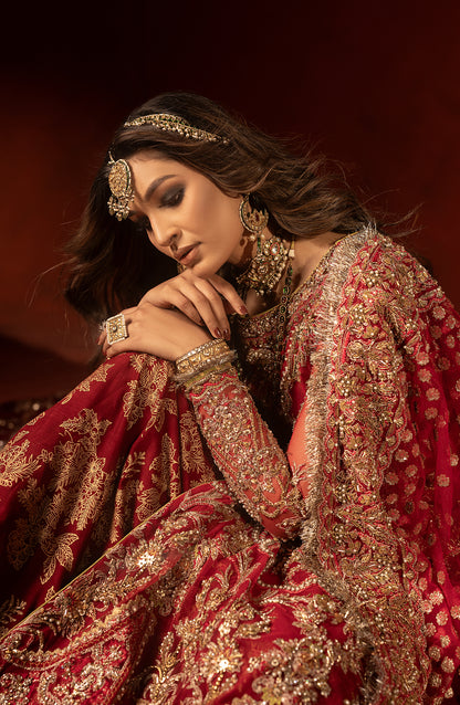 Front view of raspberry red bridal trail lehenga set with shirt blouse