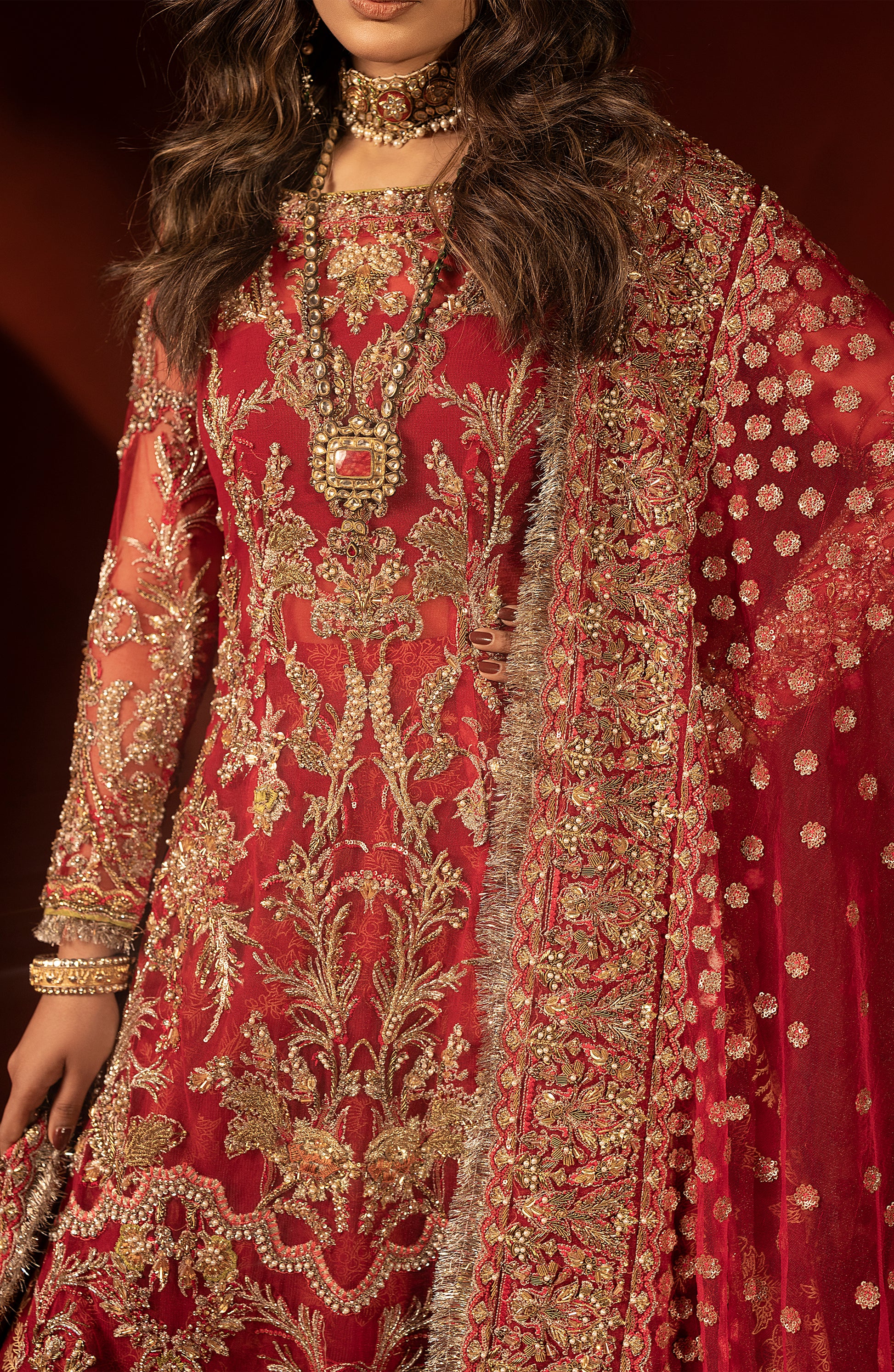 Elegant raspberry red bridal trail lehenga outfit for weddings