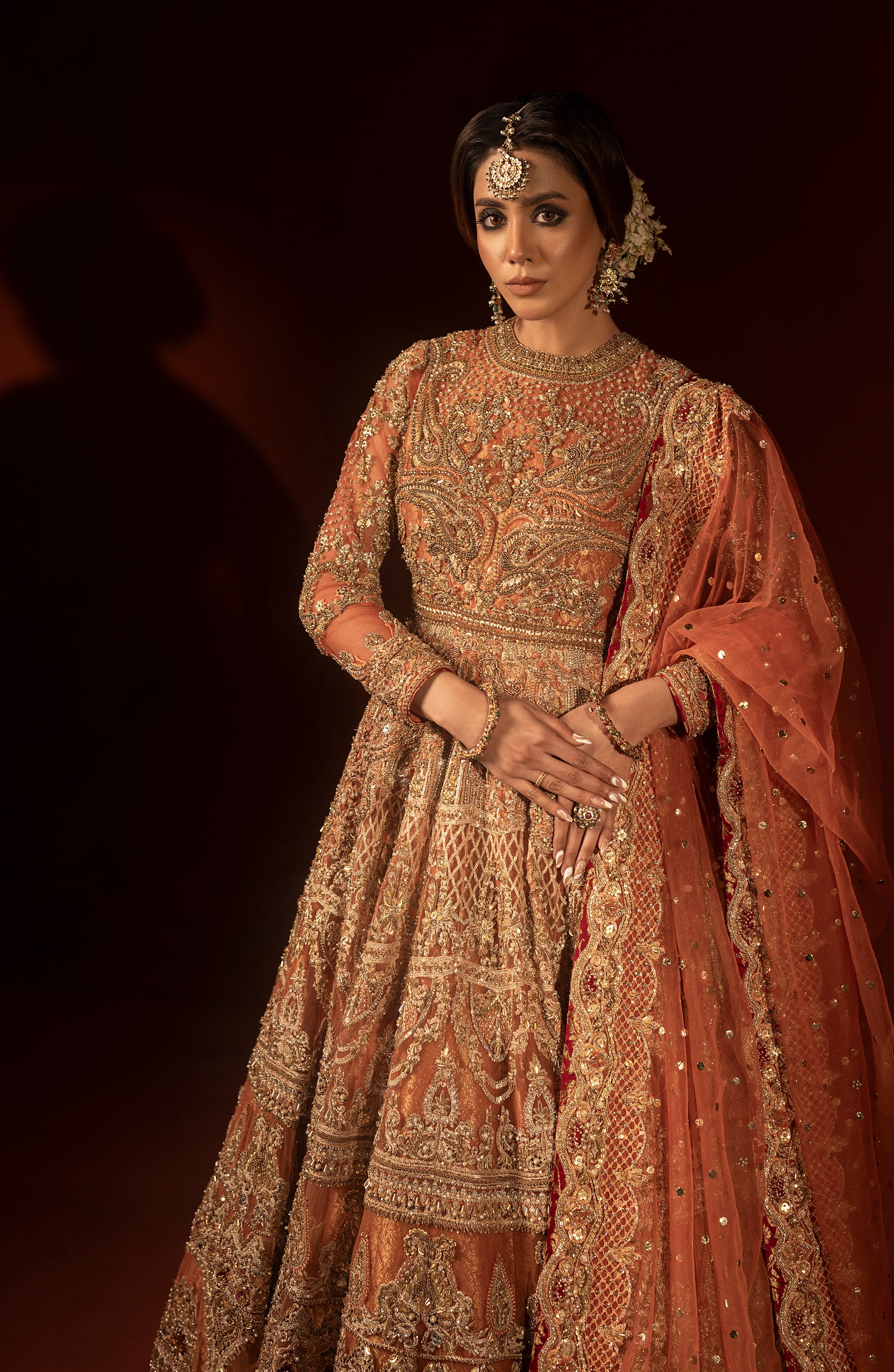Hand embroidery on rust orange bridal pishwas lehenga set