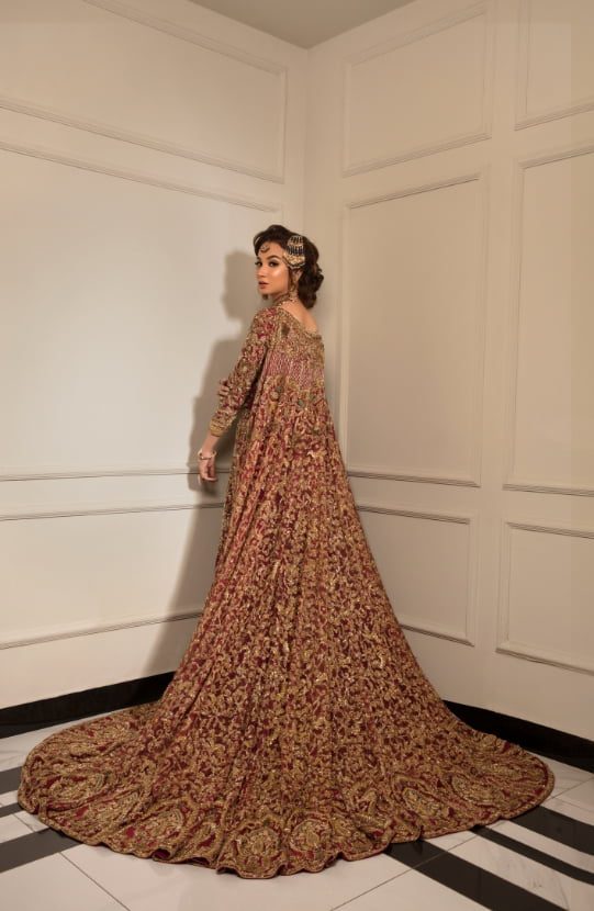 Bridal Mermaid Silhouette with an Attached Cape Paired with Lehenga-Back design of Zarina Mermaid Silhouette with flowing cape